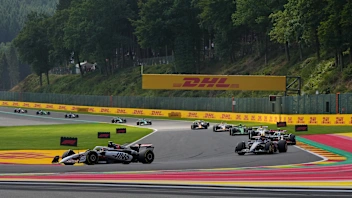 SPA, BELGIUM - JULY 26: Esteban Ocon of France driving the (31) Haas F1 VF-25 Ferrari leads Carlos