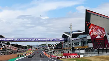 NORTHAMPTON, ENGLAND - JULY 06: The grid prepares to start the formation lap during the F1 Grand