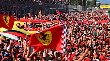 MONZA, ITALY - SEPTEMBER 07: Fans flood the track after the race for the podium ceremony during the