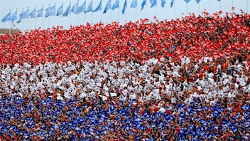 ZANDVOORT, NETHERLANDS - AUGUST 31: Fans form the Dutch flag colours in a grandstand prior to the