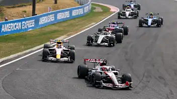 SUZUKA, JAPAN - MARCH 29: Esteban Ocon of France driving the (31) Haas F1 VF-26 Ferrari leads Liam