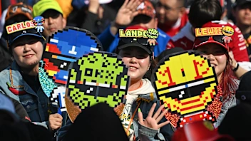 SUZUKA, JAPAN - MARCH 27: Fans of Lando Norris of Great Britain and McLaren and Lewis Hamilton of