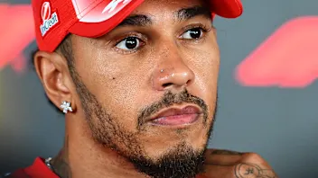 BAKU, AZERBAIJAN - SEPTEMBER 23: Lewis Hamilton of Great Britain and Scuderia Ferrari talks to the