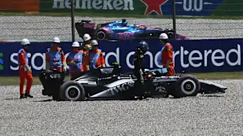 BARCELONA, SPAIN - JUNE 13: Marshals assist Valtteri Bottas of Finland and Cadillac F1 Team in the