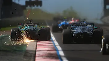 BUDAPEST, HUNGARY - JULY 26: Sparks fly behind Lance Stroll of Canada driving the (18) Aston Martin