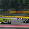SPA, BELGIUM - JULY 26: Esteban Ocon of France driving the (31) Haas F1 VF-25 Ferrari leads Carlos