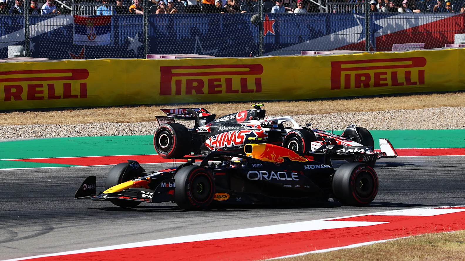 AUSTIN, TEXAS - OCTOBER 19: Yuki Tsunoda of Japan driving the (22) Oracle Red Bull Racing RB21 passes as Oliver Bearman of Great Britain driving the (87) Haas F1 VF-25 Ferrari spins during the F1 Grand Prix of United States at Circuit of The Americas on October 19, 2025 in Austin, Texas. (Photo by Zak Mauger/LAT Images)