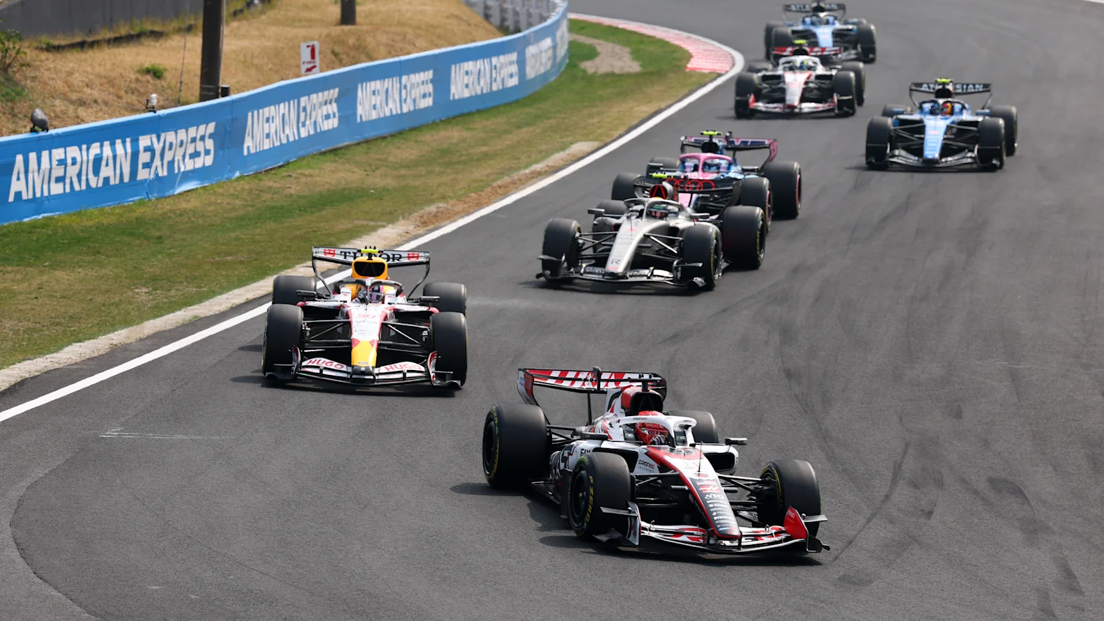SUZUKA, JAPAN - MARCH 29: Esteban Ocon of France driving the (31) Haas F1 VF-26 Ferrari leads Liam