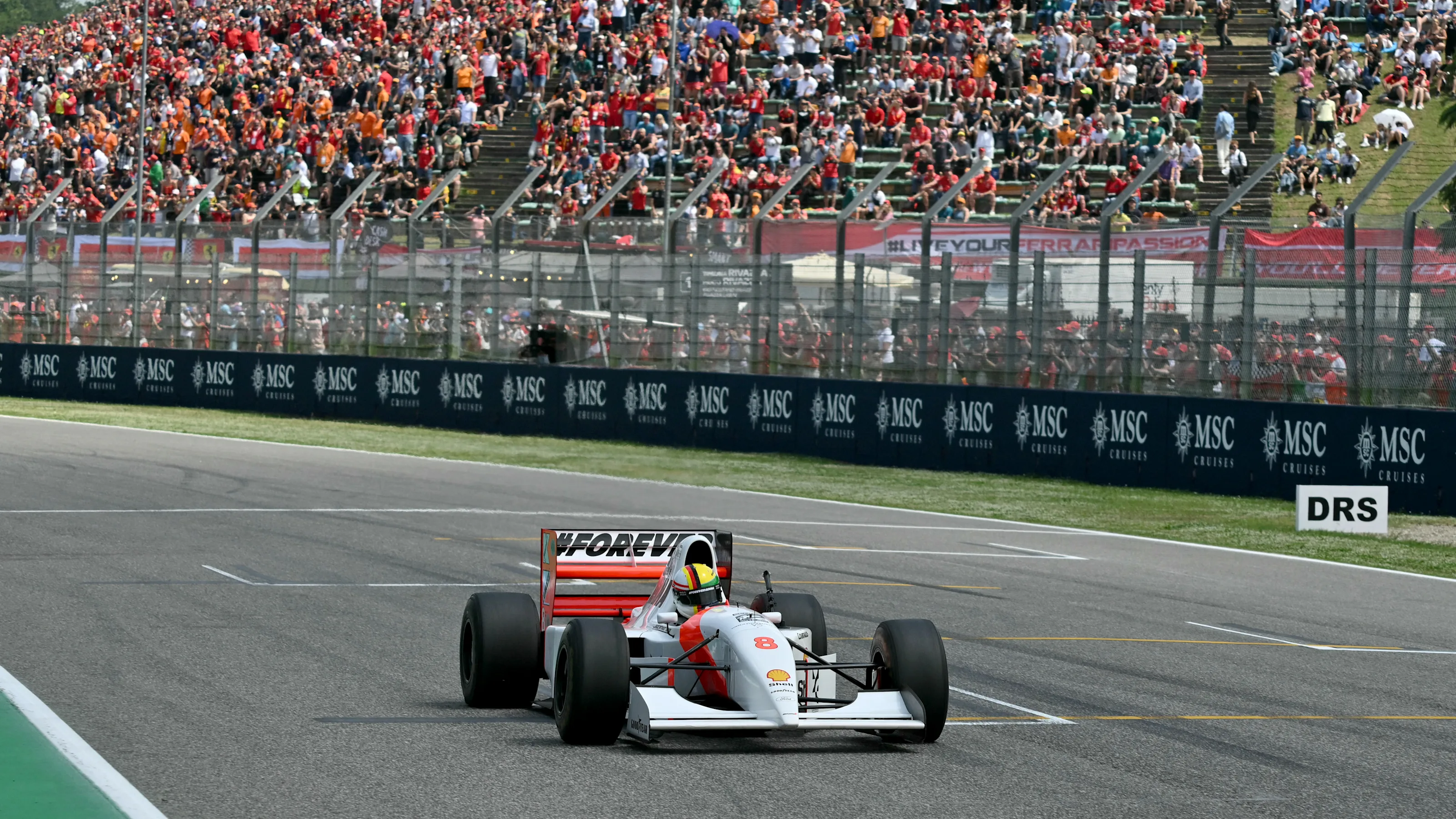 TOPSHOT - German former Formula One champion Sebastian Vettel drives the historic McLaren car of