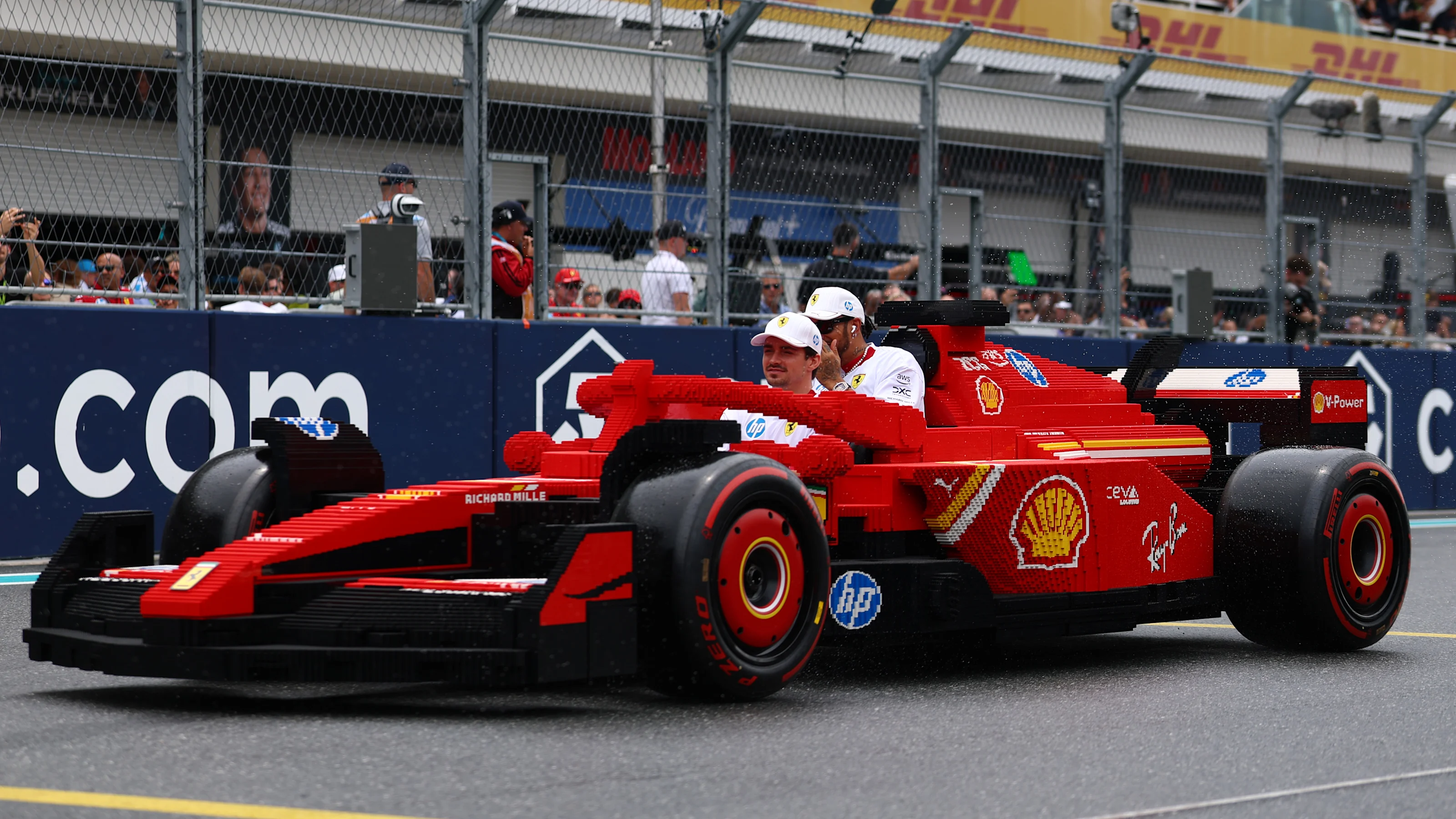 MIAMI, FLORIDA - MAY 04: Charles Leclerc of Monaco and Scuderia Ferrari and Lewis Hamilton of Great