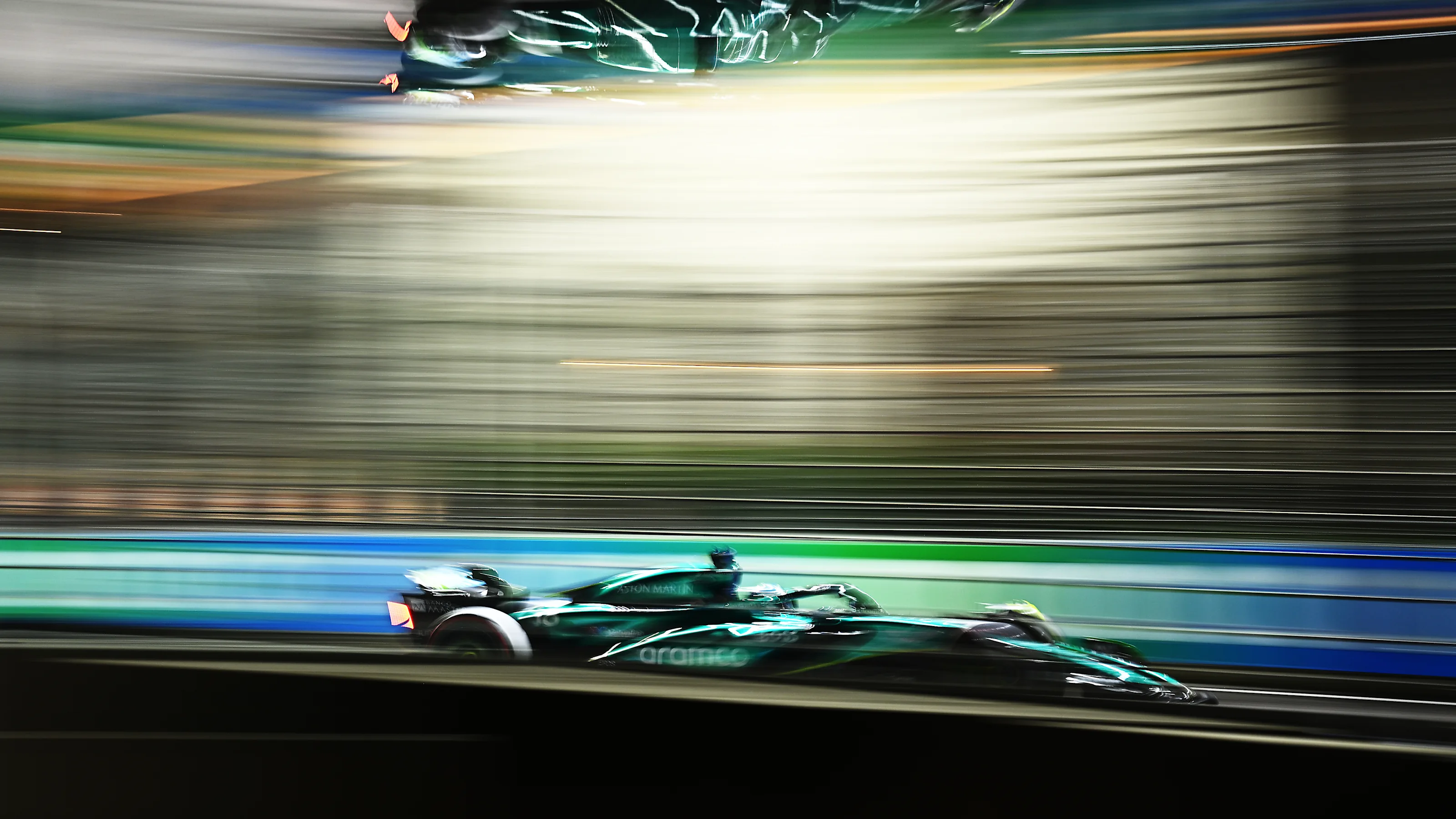 SINGAPORE, SINGAPORE - SEPTEMBER 20: Lance Stroll of Canada driving the (18) Aston Martin AMR24