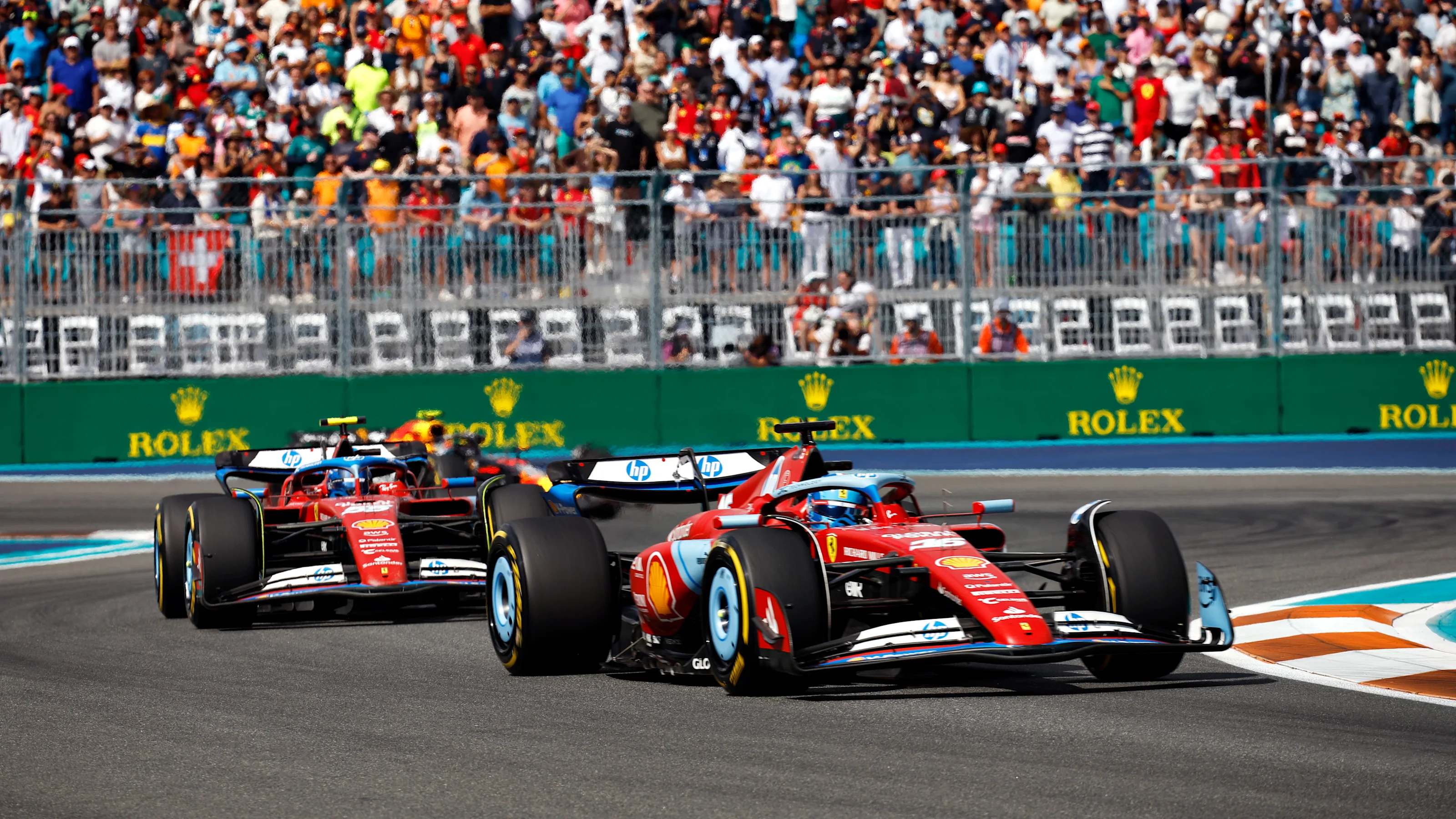 MIAMI, FLORIDA - MAY 05: Charles Leclerc of Monaco driving the (16) Ferrari SF-24 leads Carlos