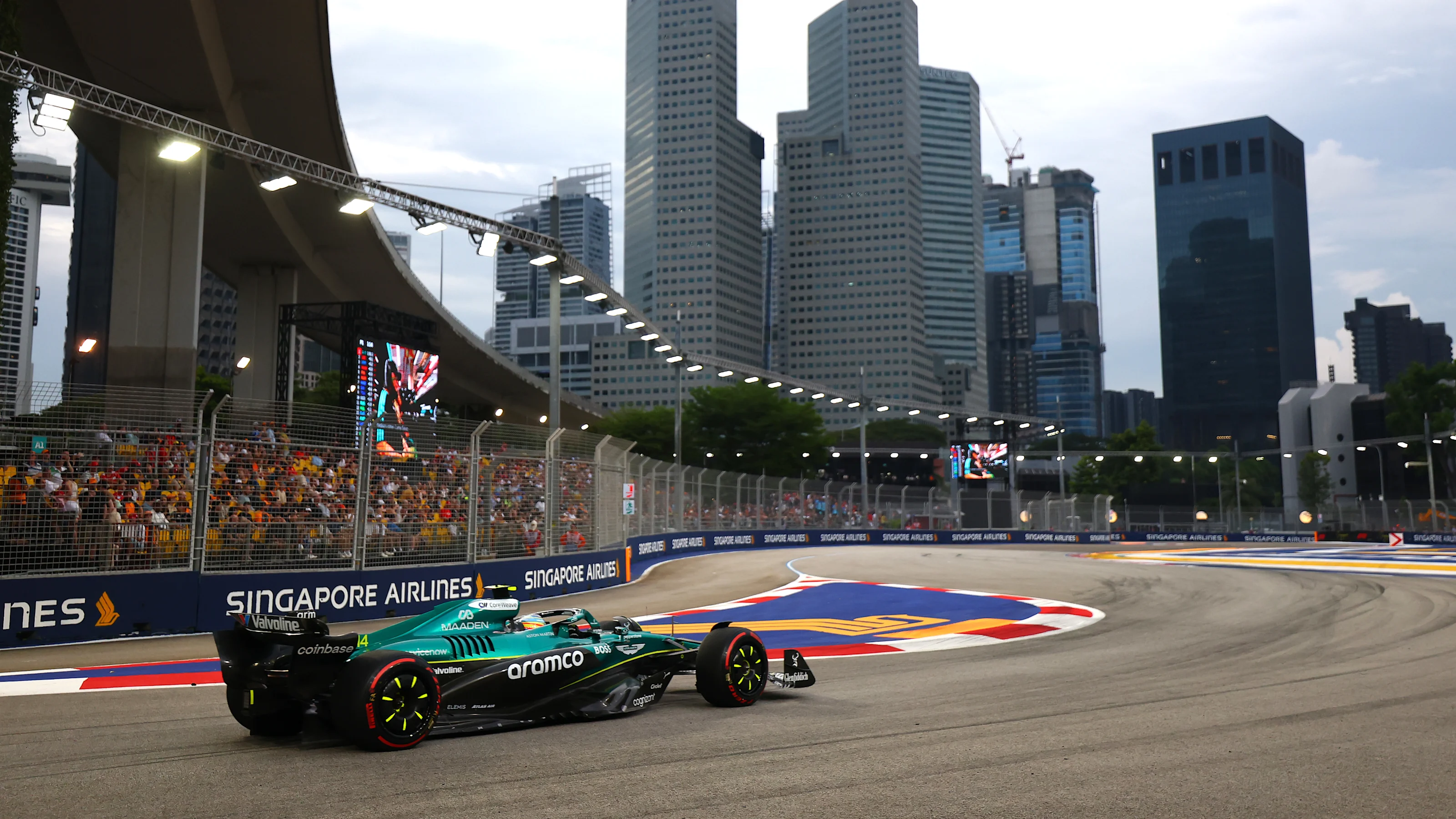 SINGAPORE, SINGAPORE - OCTOBER 03: Fernando Alonso of Spain driving the (14) Aston Martin F1 Team