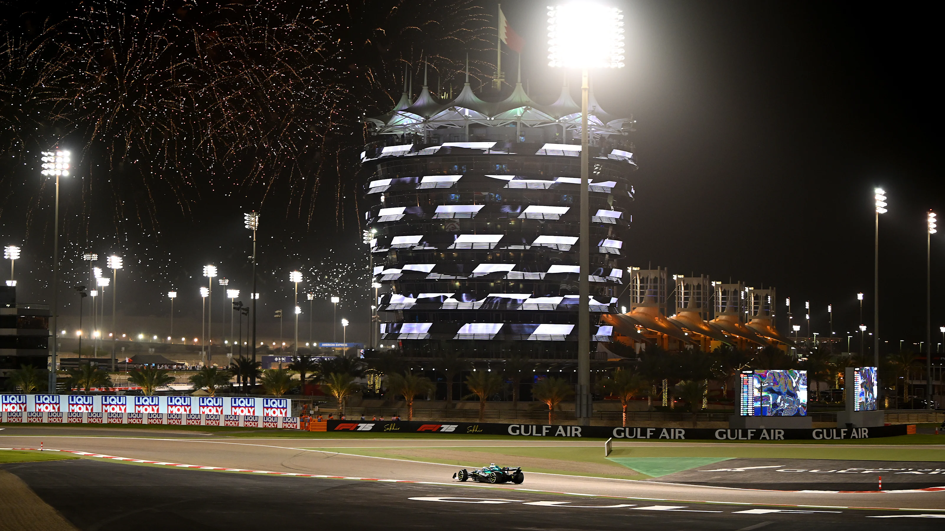 BAHRAIN, BAHRAIN - APRIL 13: Fireworks light the sky as Lance Stroll of Canada driving the (18)
