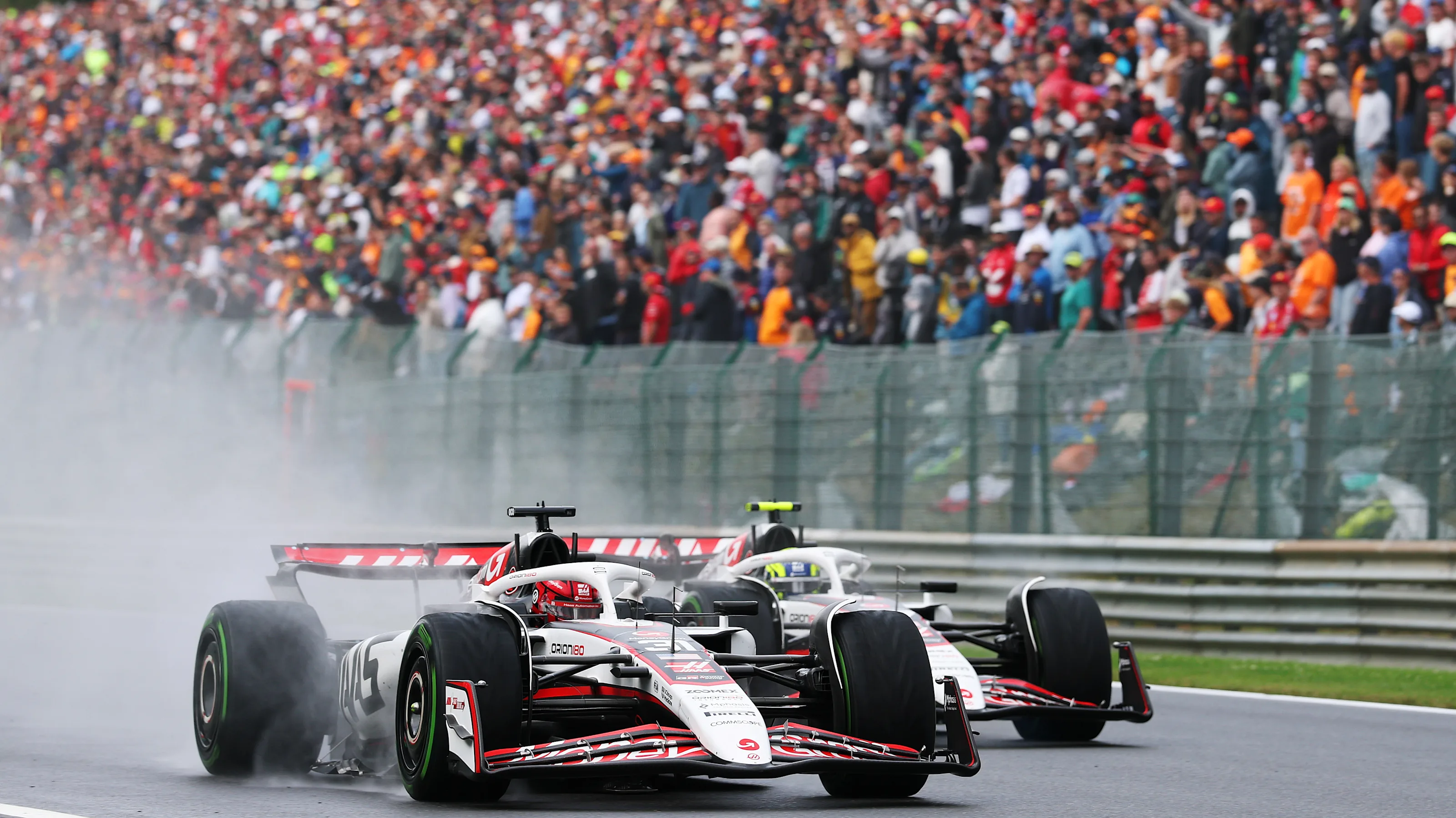 SPA, BELGIUM - JULY 27: Esteban Ocon of France driving the (31) Haas F1 VF-25 Ferrari leads Oliver