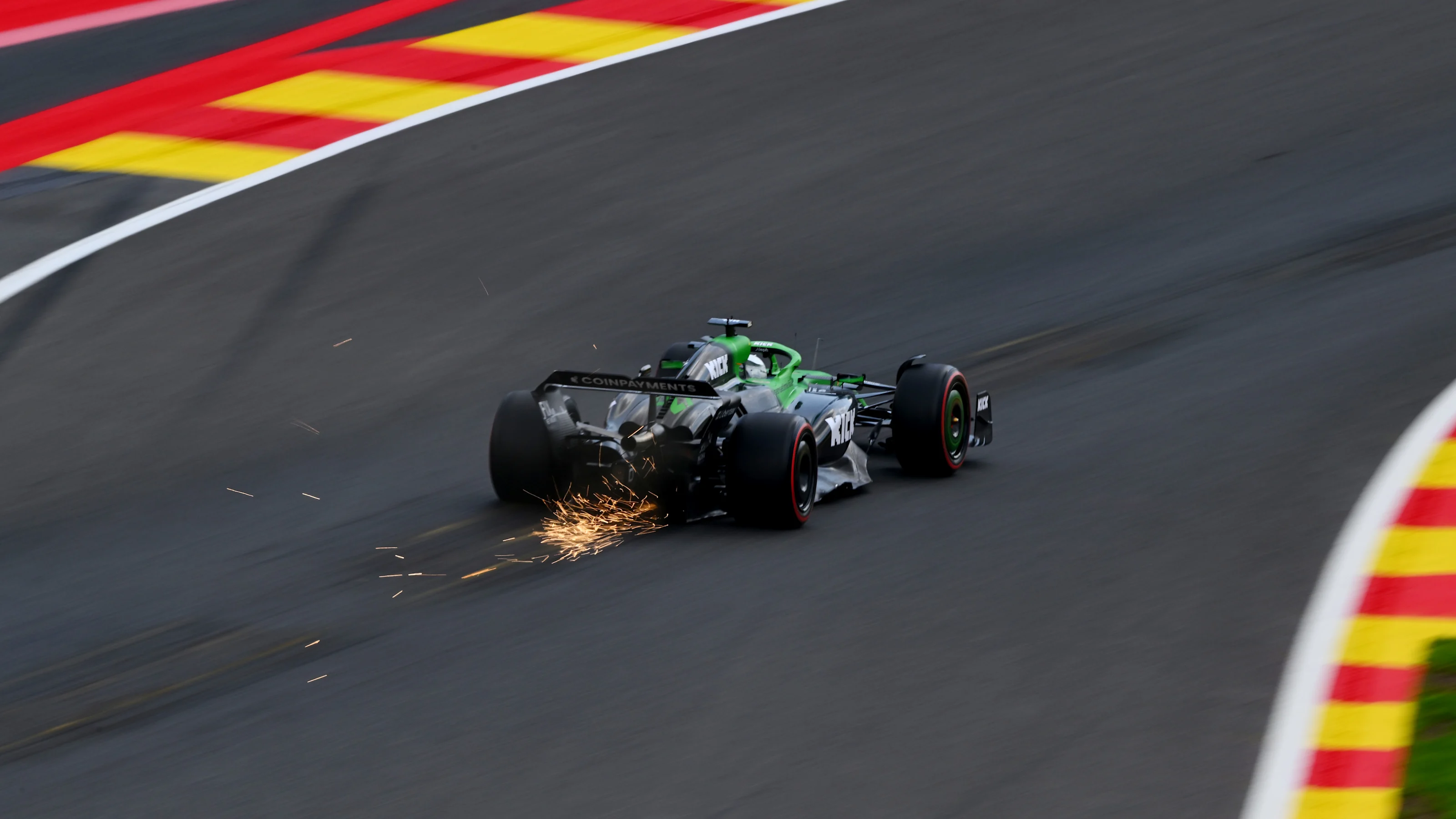 SPA, BELGIUM - JULY 25: Sparks fly behind Nico Hulkenberg of Germany driving the (27) Kick Sauber