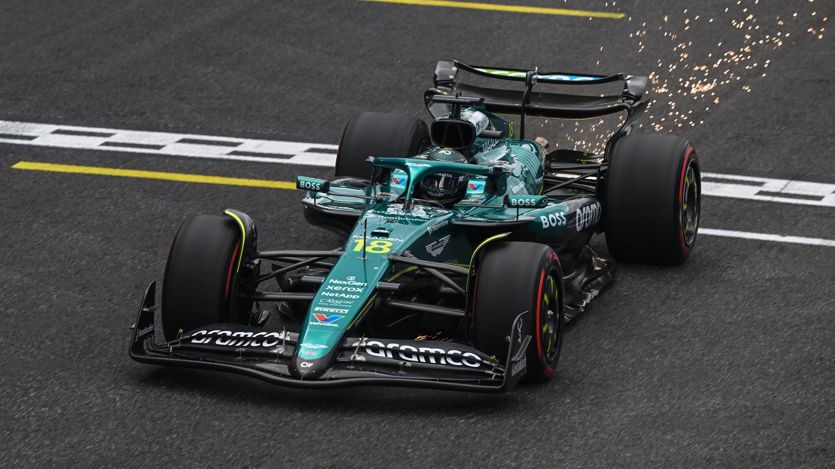 SAO PAULO, BRAZIL - NOVEMBER 08: Sparks fly behind Lance Stroll of Canada driving the (18) Aston