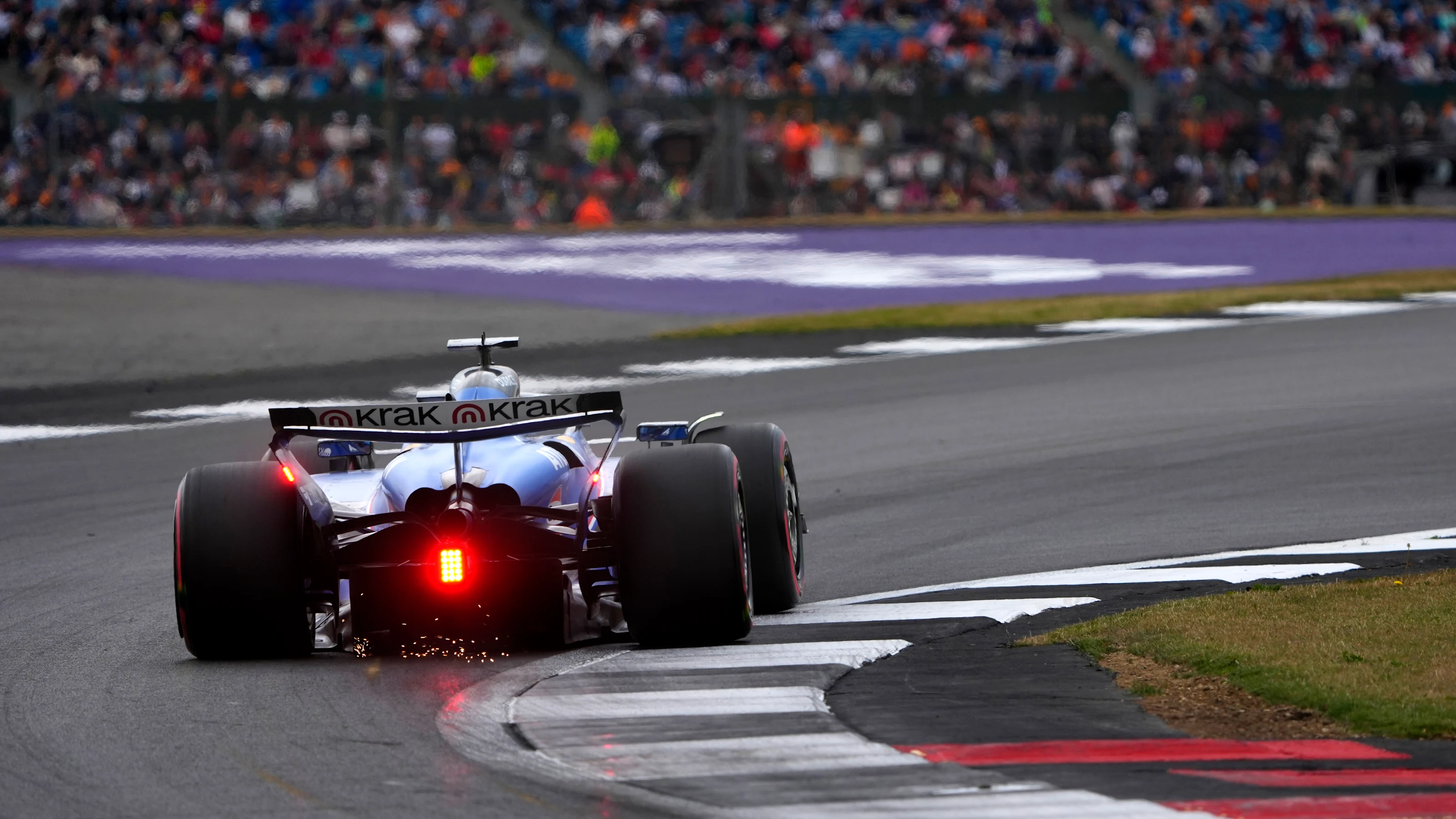 NORTHAMPTON, ENGLAND - JULY 05: Sparks fly behind Alexander Albon of Thailand driving the (23)
