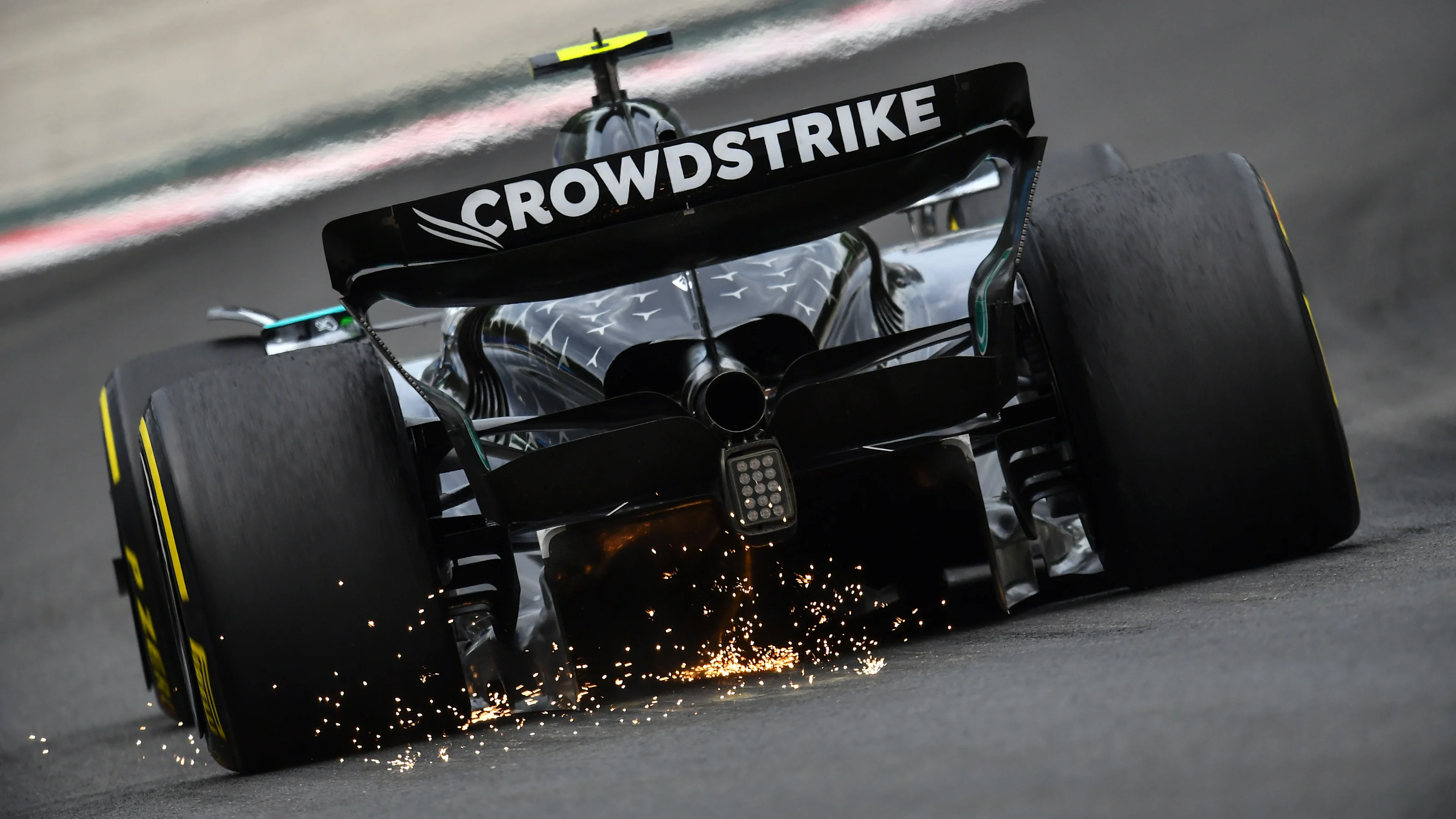 BUDAPEST, HUNGARY - AUGUST 03: Sparks fly behind Andrea Kimi Antonelli of Italy driving the (12)