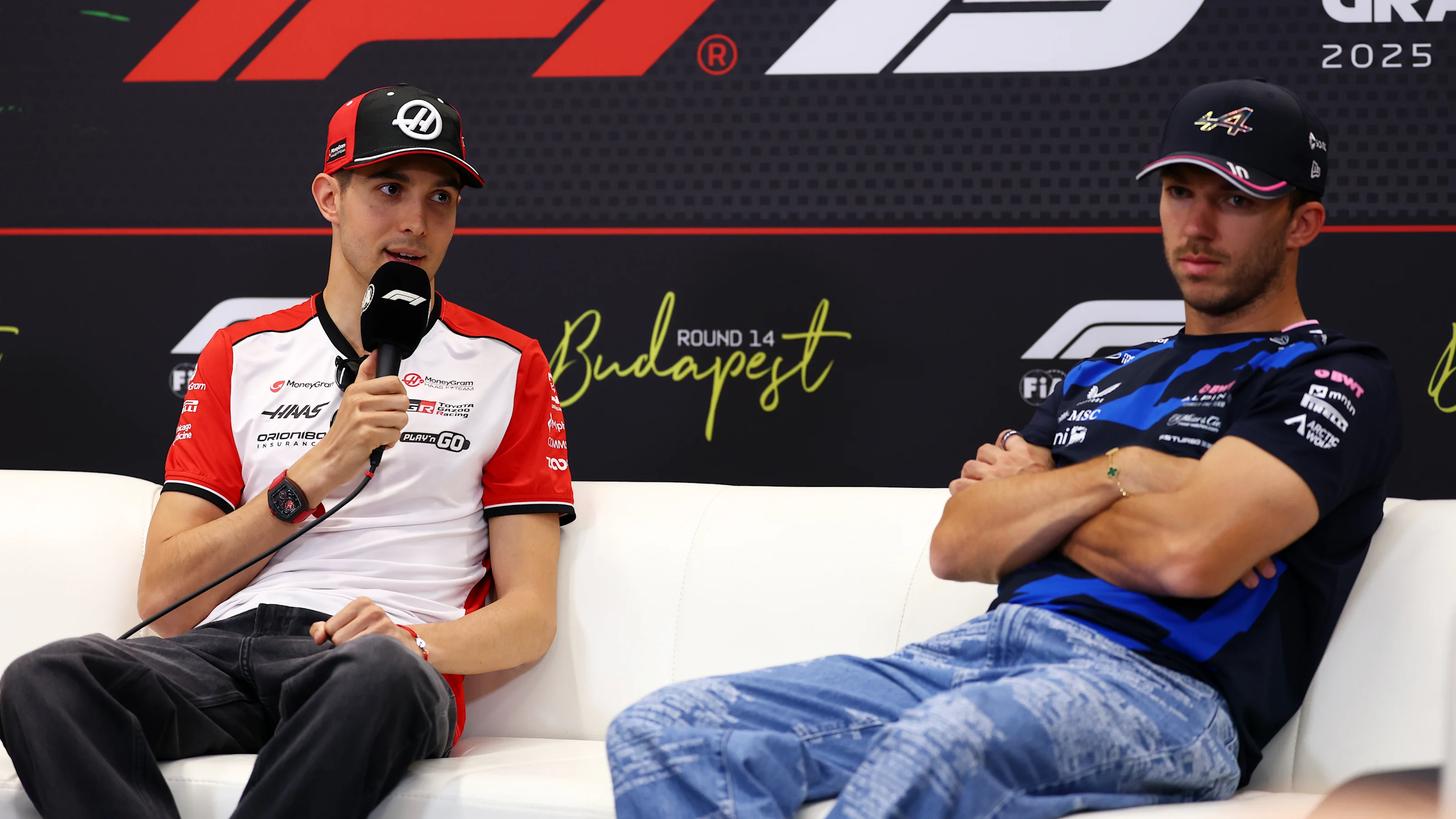 BUDAPEST, HUNGARY - JULY 31: Esteban Ocon of France and Haas F1 and Pierre Gasly of France and