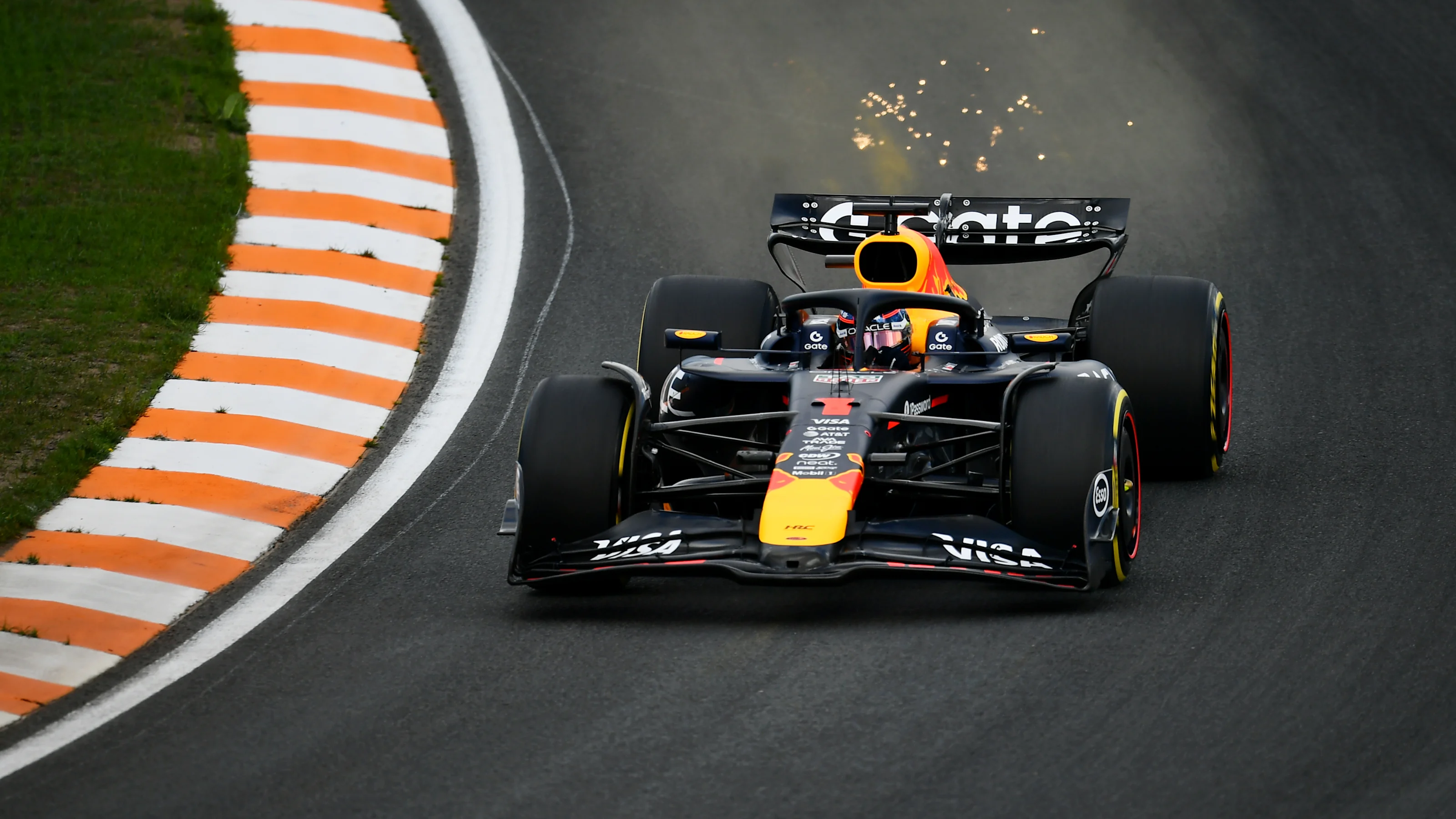ZANDVOORT, NETHERLANDS - AUGUST 29: Sparks fly behind Max Verstappen of the Netherlands driving the