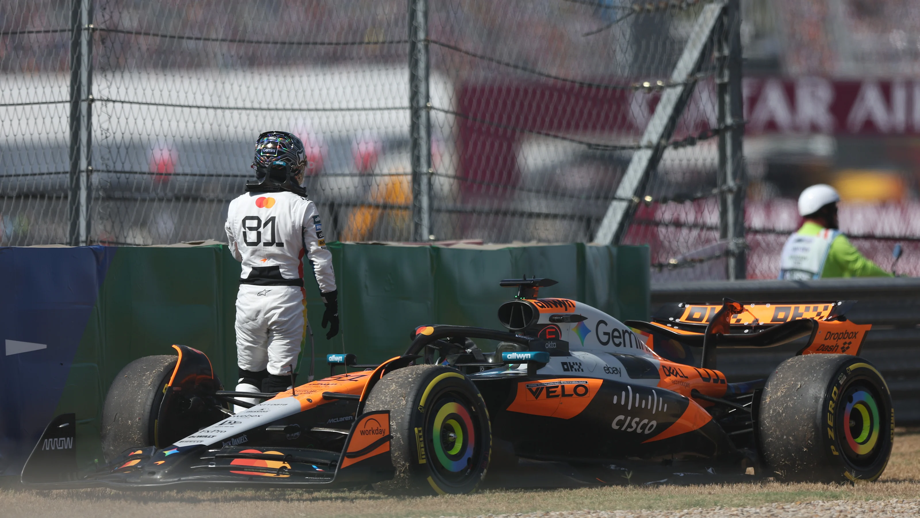 AUSTIN, TEXAS - OCTOBER 18: Oscar Piastri of Australia and McLaren walks away from his damaged car