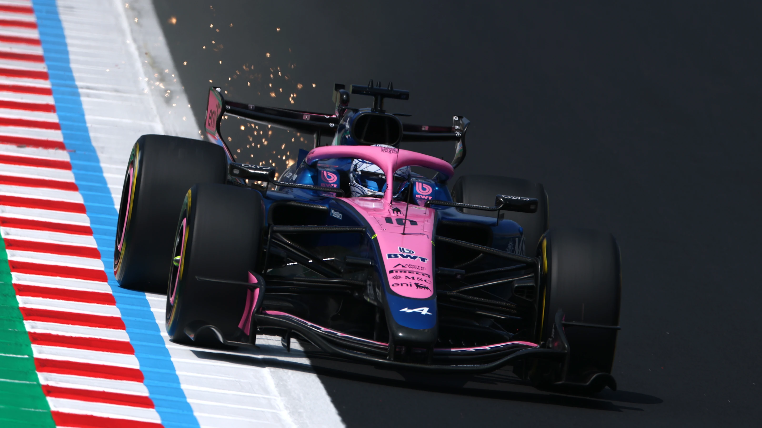 SUZUKA, JAPAN - MARCH 28: Sparks fly behind Pierre Gasly of France driving the (10) Alpine F1 A526