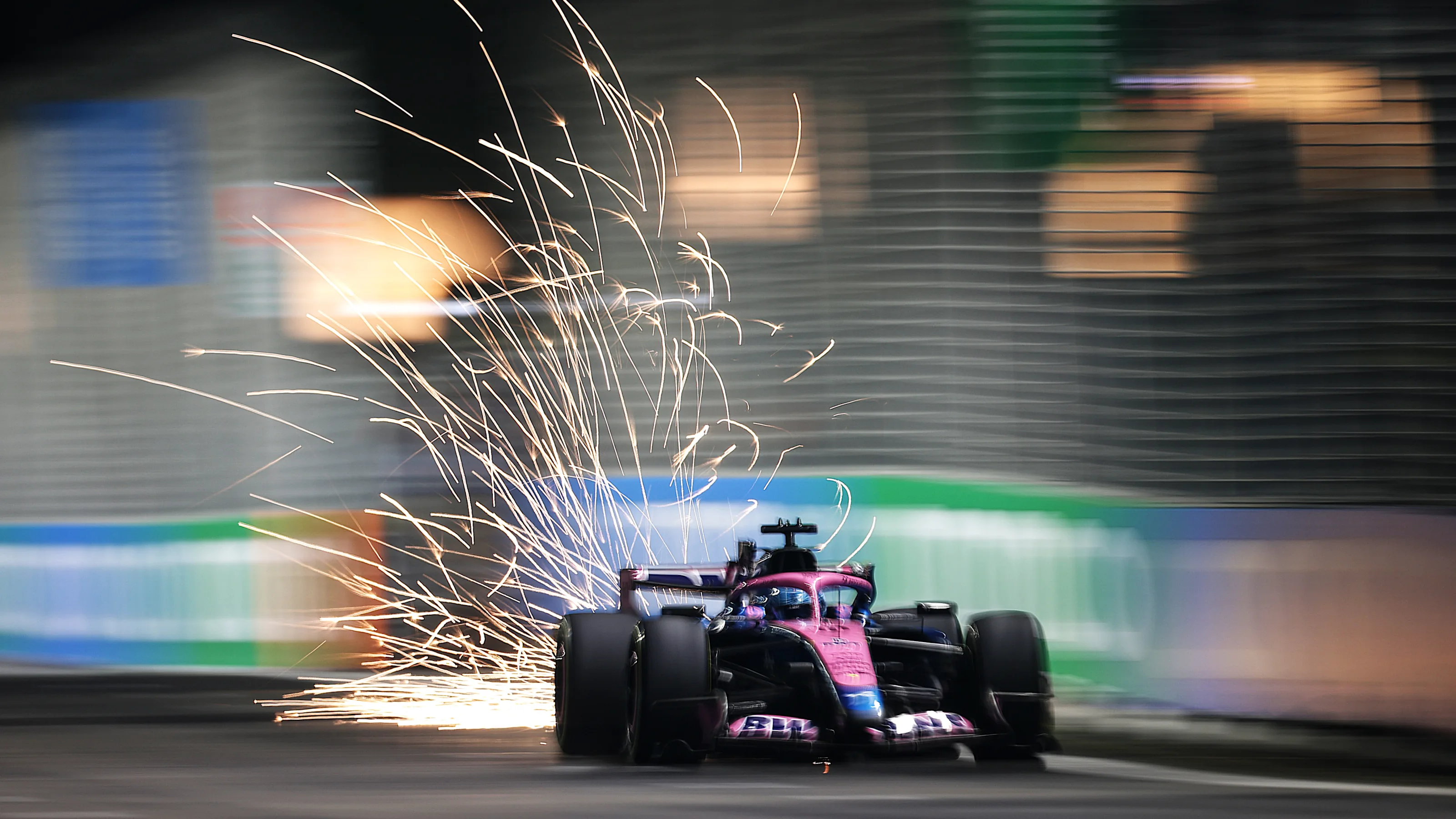SINGAPORE, SINGAPORE - OCTOBER 09: Sparks fly behind Pierre Gasly of France driving the (10) Alpine