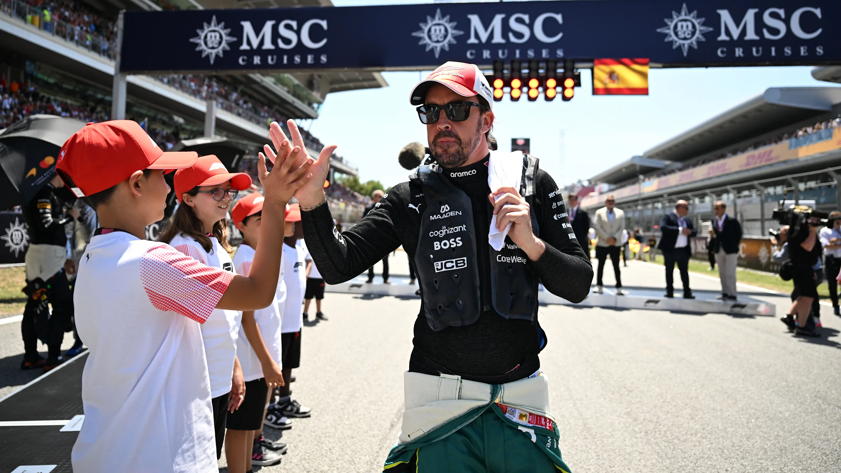 BARCELONA, SPAIN - JUNE 14: Fernando Alonso of Spain and Aston Martin F1 Team on the grid with Grid