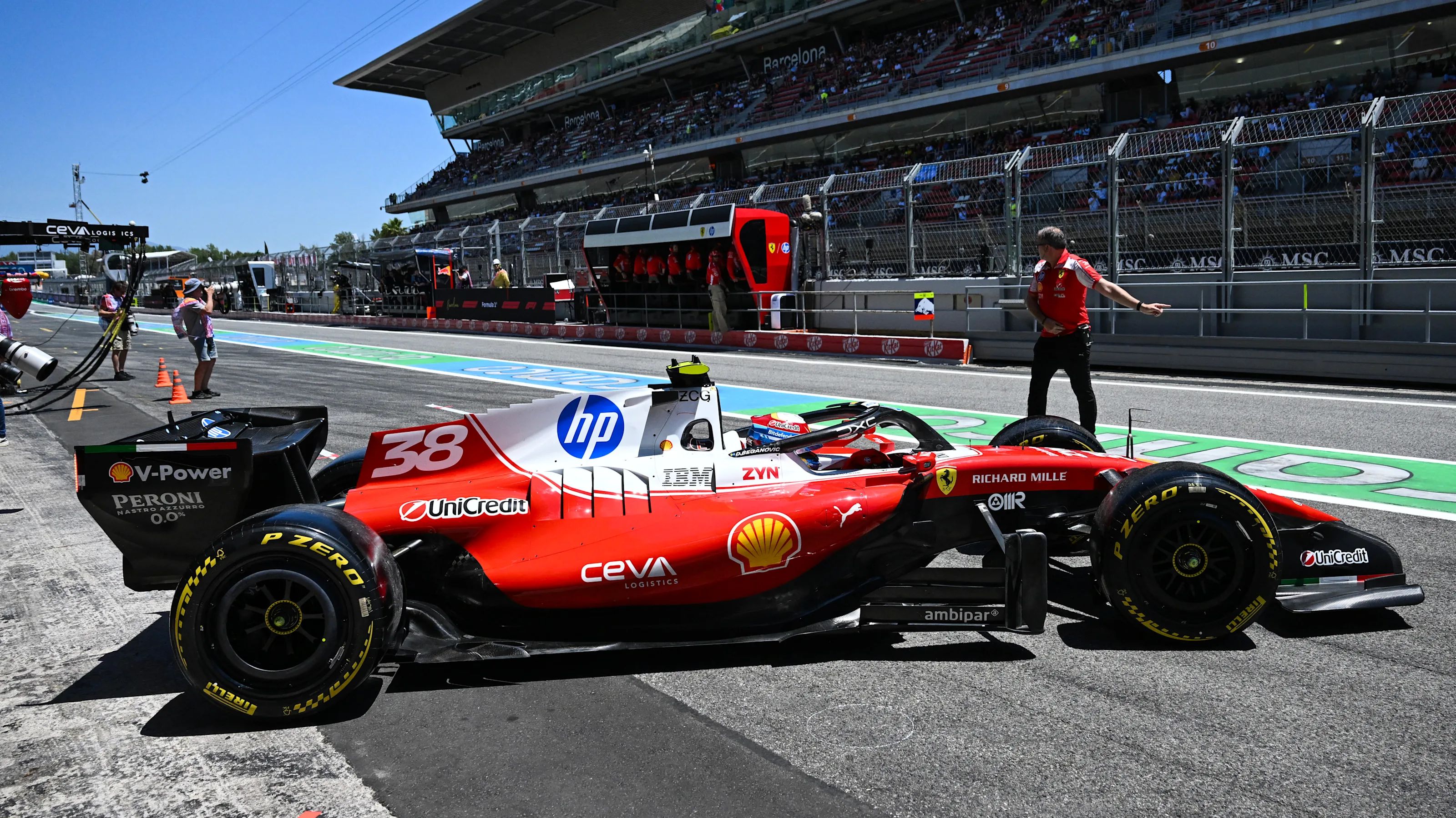 BARCELONA, SPAIN - JUNE 12: Dino Beganovic of Sweden driving the (38) Scuderia Ferrari SF-26 leaves