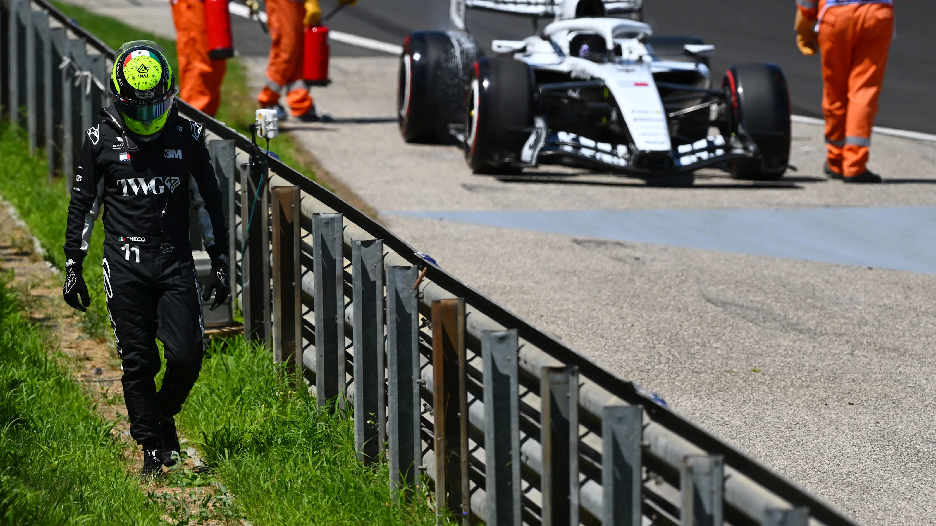BUDAPEST, HUNGARY - JULY 25: Sergio Perez of Mexico and Cadillac F1 Team walks away after stopping
