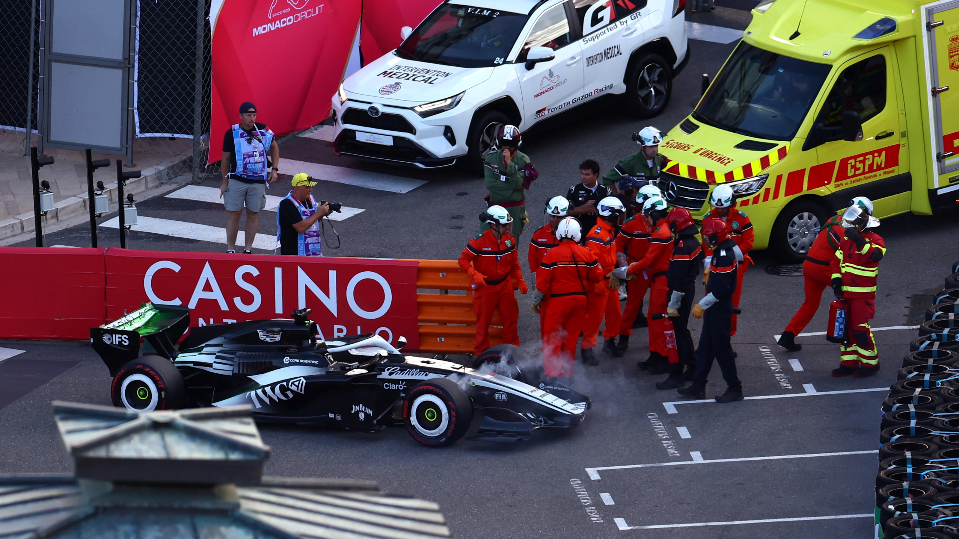 MONTE-CARLO, MONACO - JUNE 05: Marshals remove the car of Sergio Perez of Mexico and Cadillac F1
