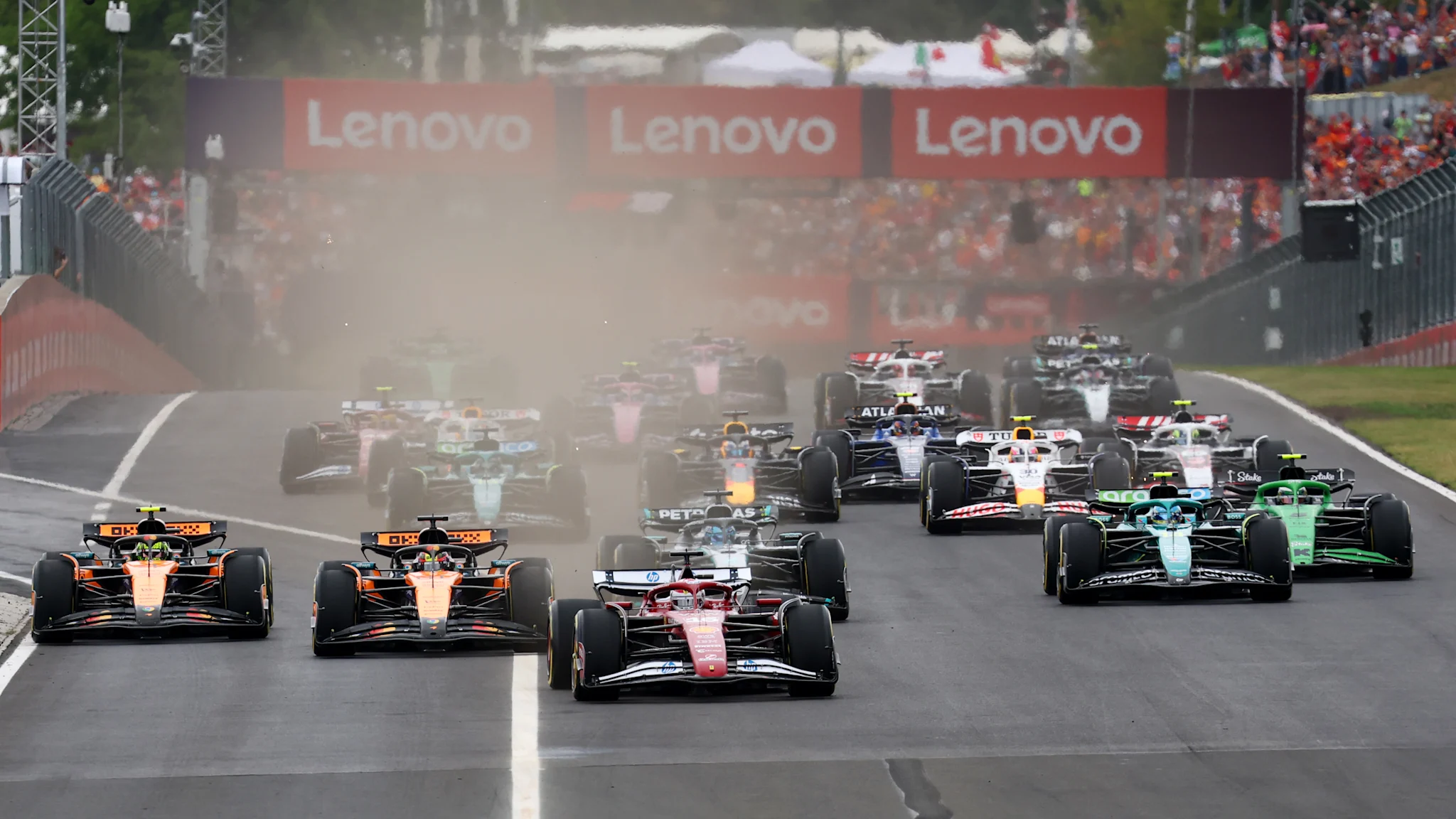 Charles Leclerc holds onto race lead as Lando Norris loses out on opening lap of Hungarian GP