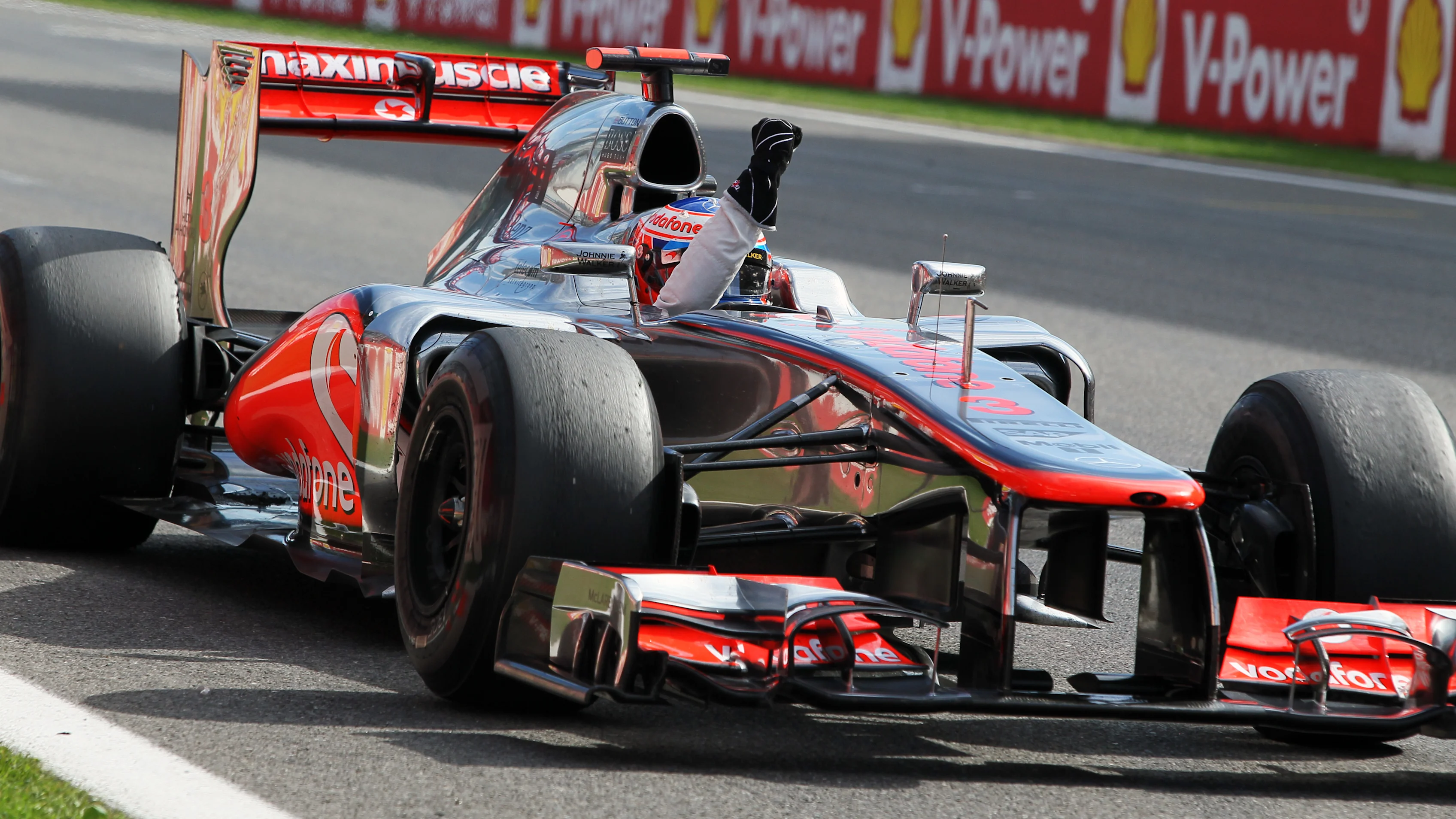 Race winner Jenson Button (GBR) McLaren MP4-27 celebrates at the end of the race.\nFormula One