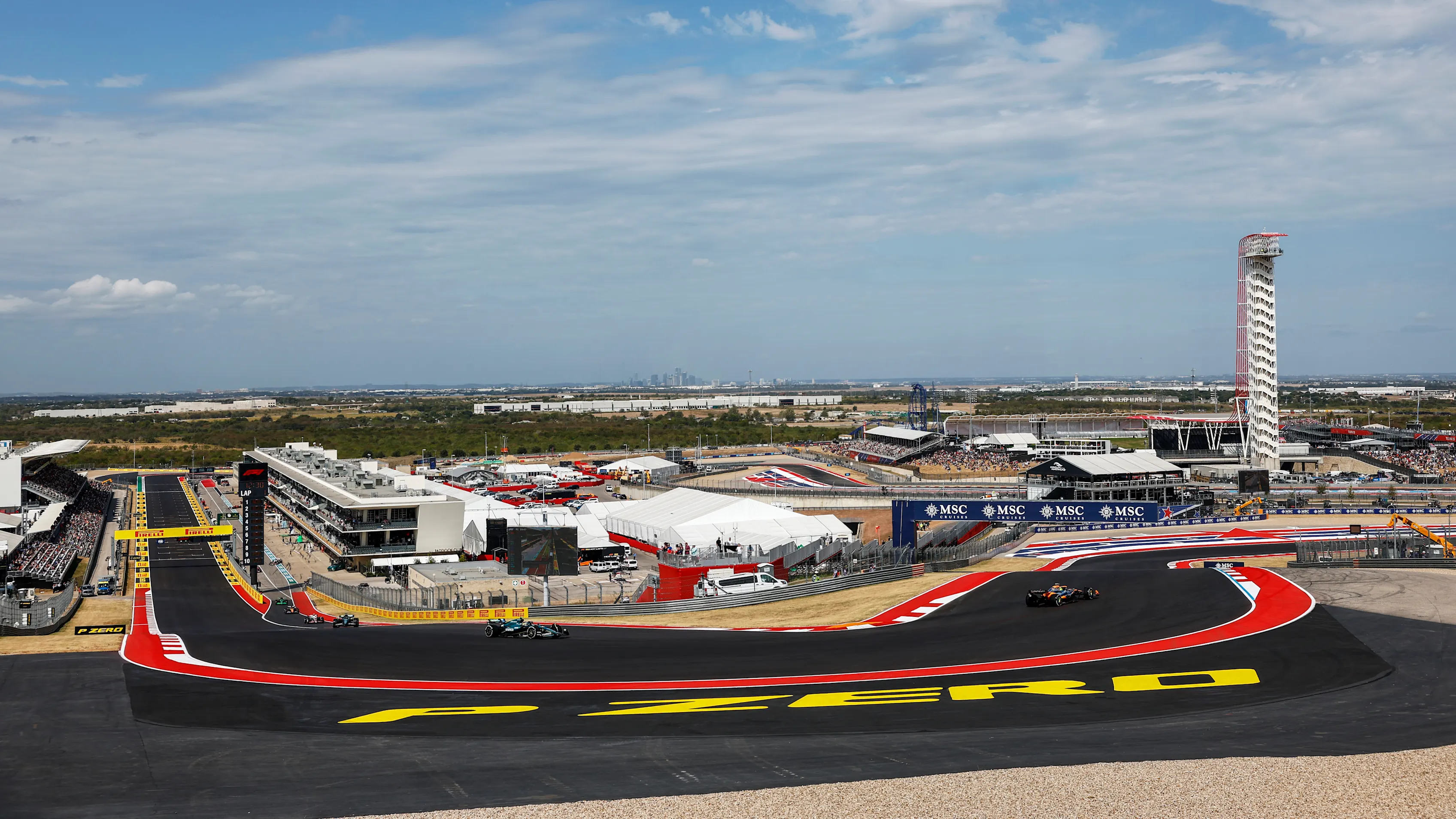 AUSTIN, UNITED STATES - OCTOBER 18: Lando Norris, McLaren MCL38, leads Fernando Alonso, Aston