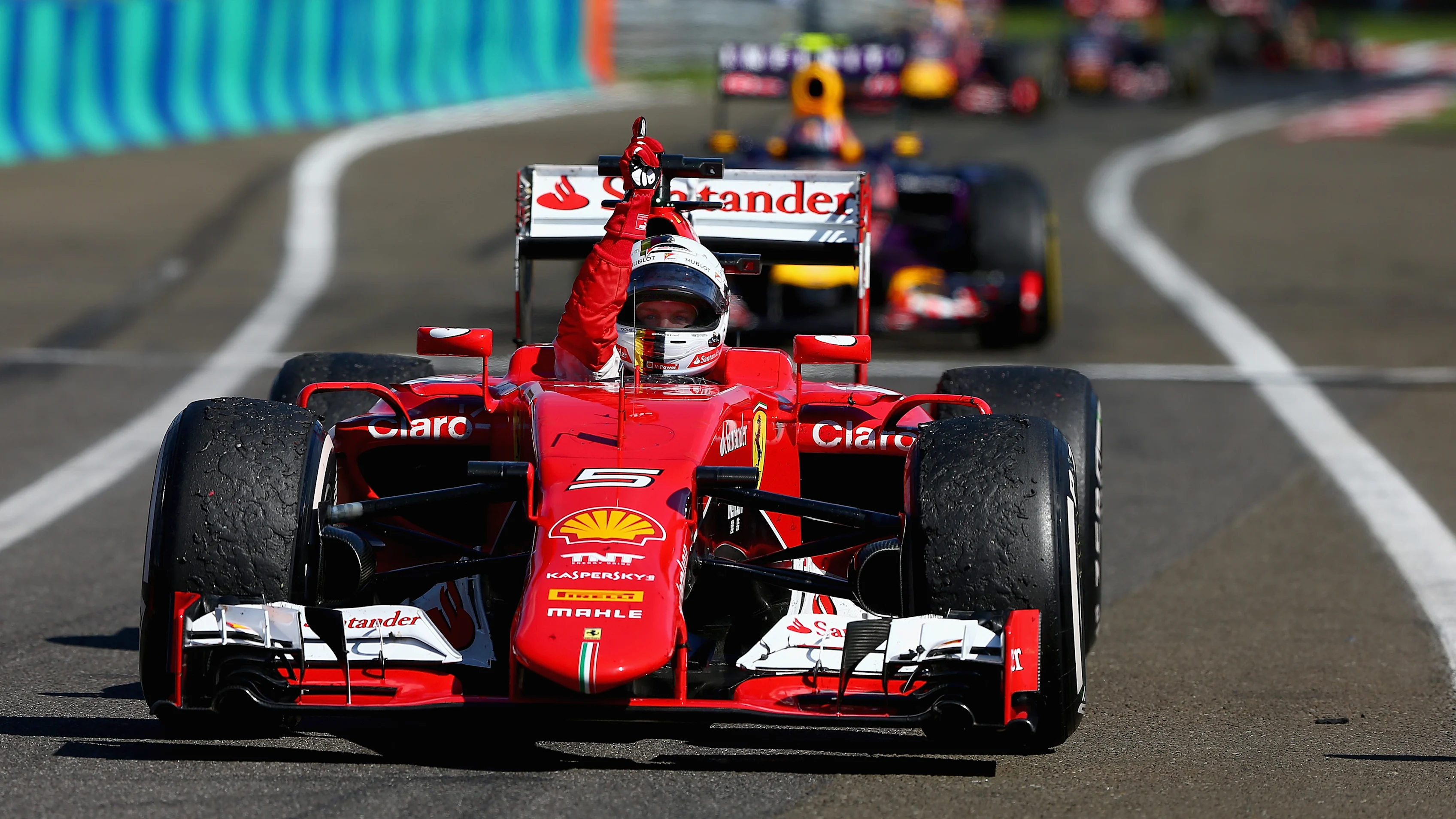 BUDAPEST, HUNGARY - JULY 26: Sebastian Vettel of Germany and Ferrari celebrates as he approaches