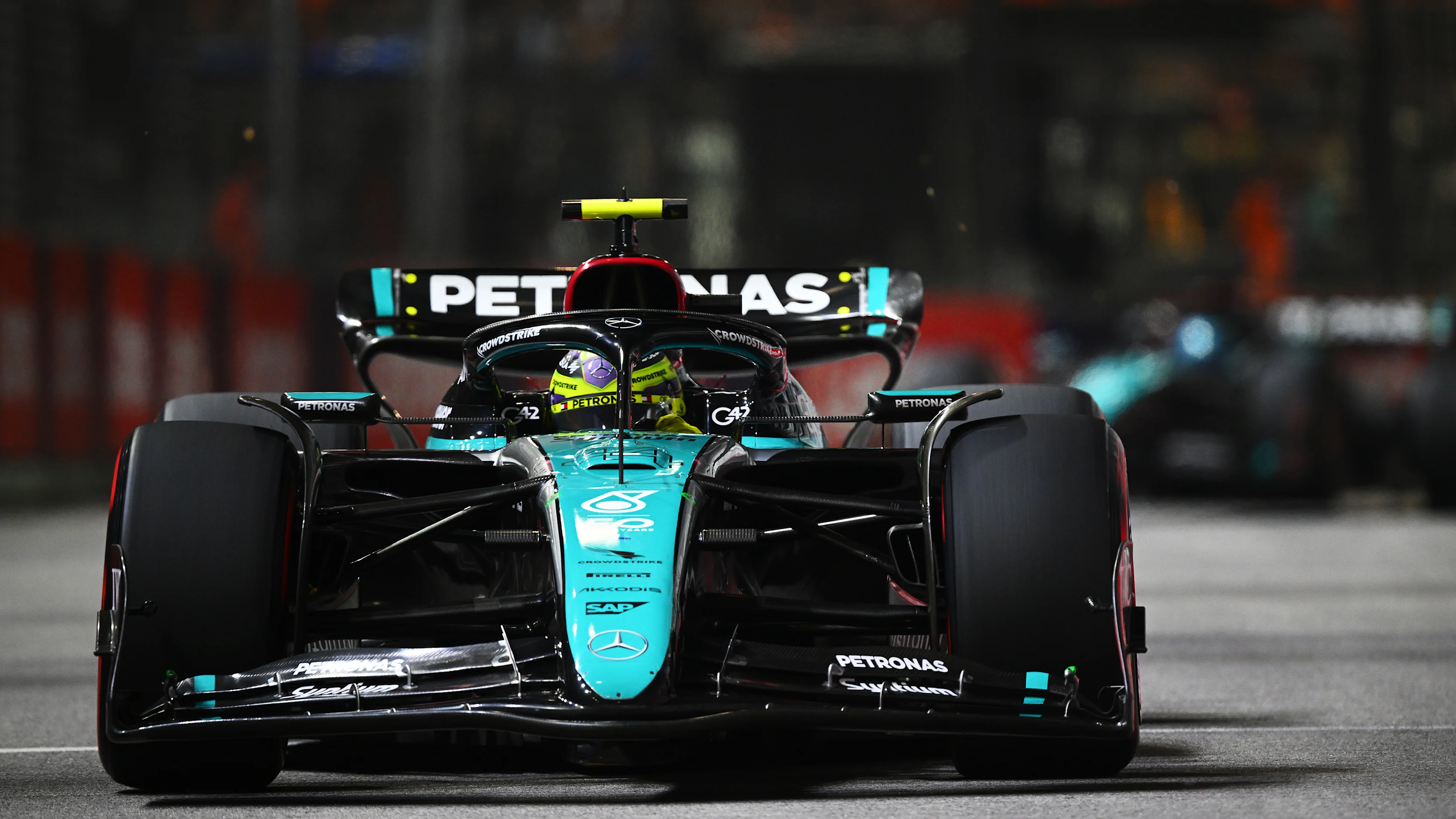 SINGAPORE, SINGAPORE - SEPTEMBER 22: Lewis Hamilton of Great Britain driving the (44) Mercedes AMG