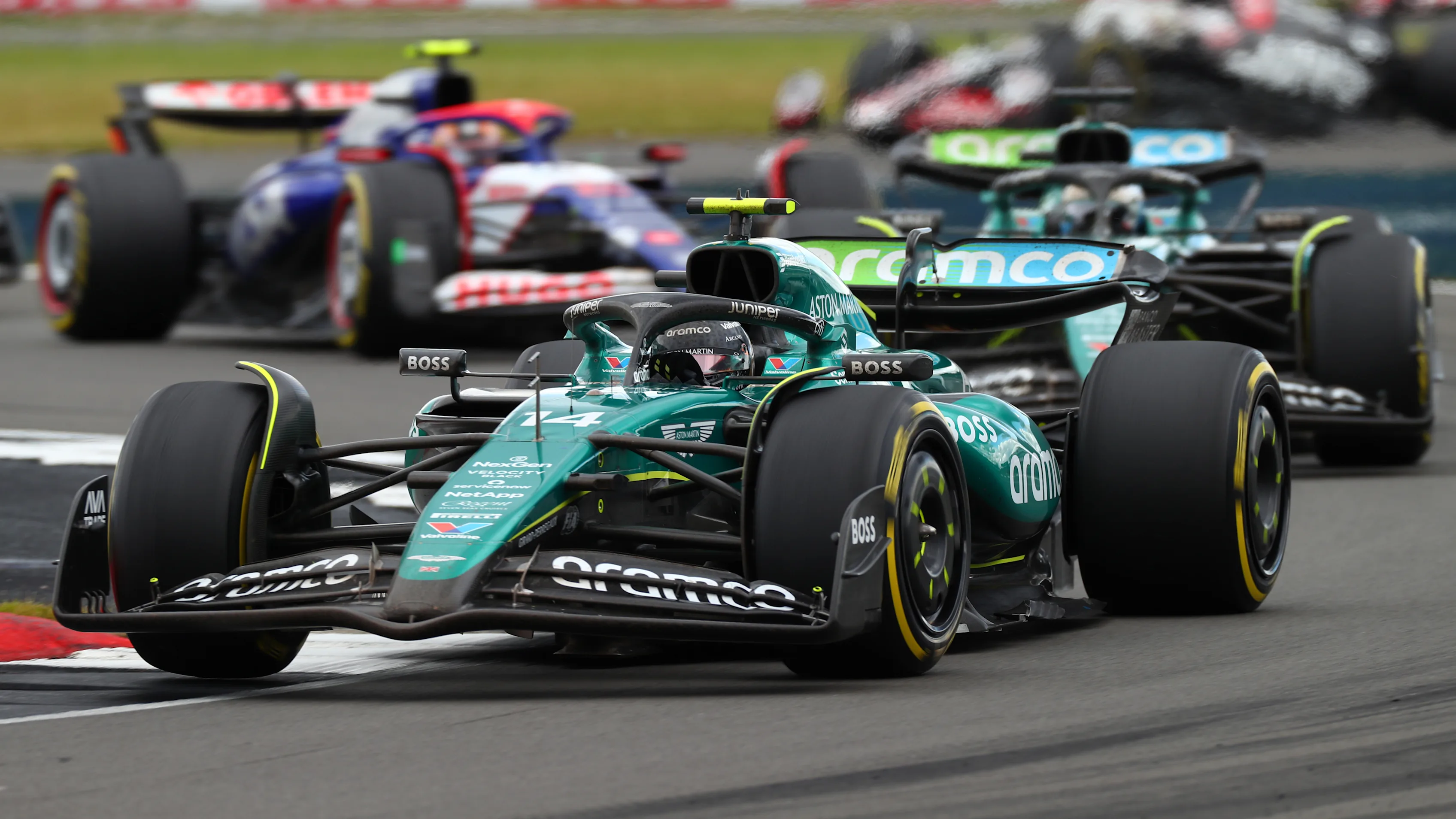 NORTHAMPTON, ENGLAND - JULY 07: Fernando Alonso of Spain driving the (14) Aston Martin AMR24 Mercedes leads Lance Stroll of Canada driving the (18) Aston Martin AMR24 Mercedes during the F1 Grand Prix of Great Britain at Silverstone Circuit on July 07, 2024 in Northampton, England. (Photo by Peter Fox - Formula 1/Formula 1 via Getty Images)