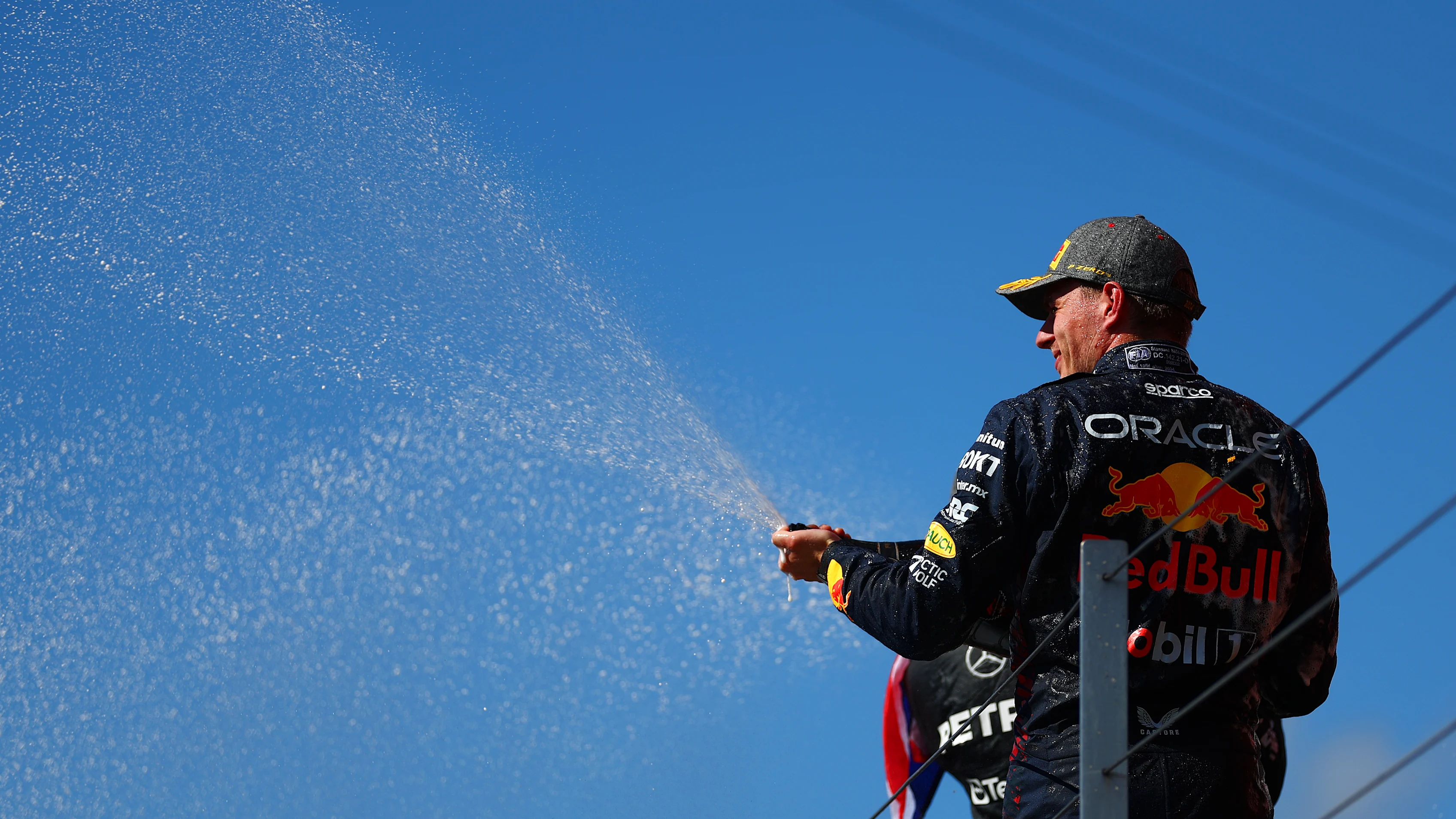 NORTHAMPTON, ENGLAND - JULY 07: Second placed Max Verstappen of the Netherlands and Oracle Red Bull Racing celebrates on the podium during the F1 Grand Prix of Great Britain at Silverstone Circuit on July 07, 2024 in Northampton, England. (Photo by Bryn Lennon - Formula 1/Formula 1 via Getty Images)