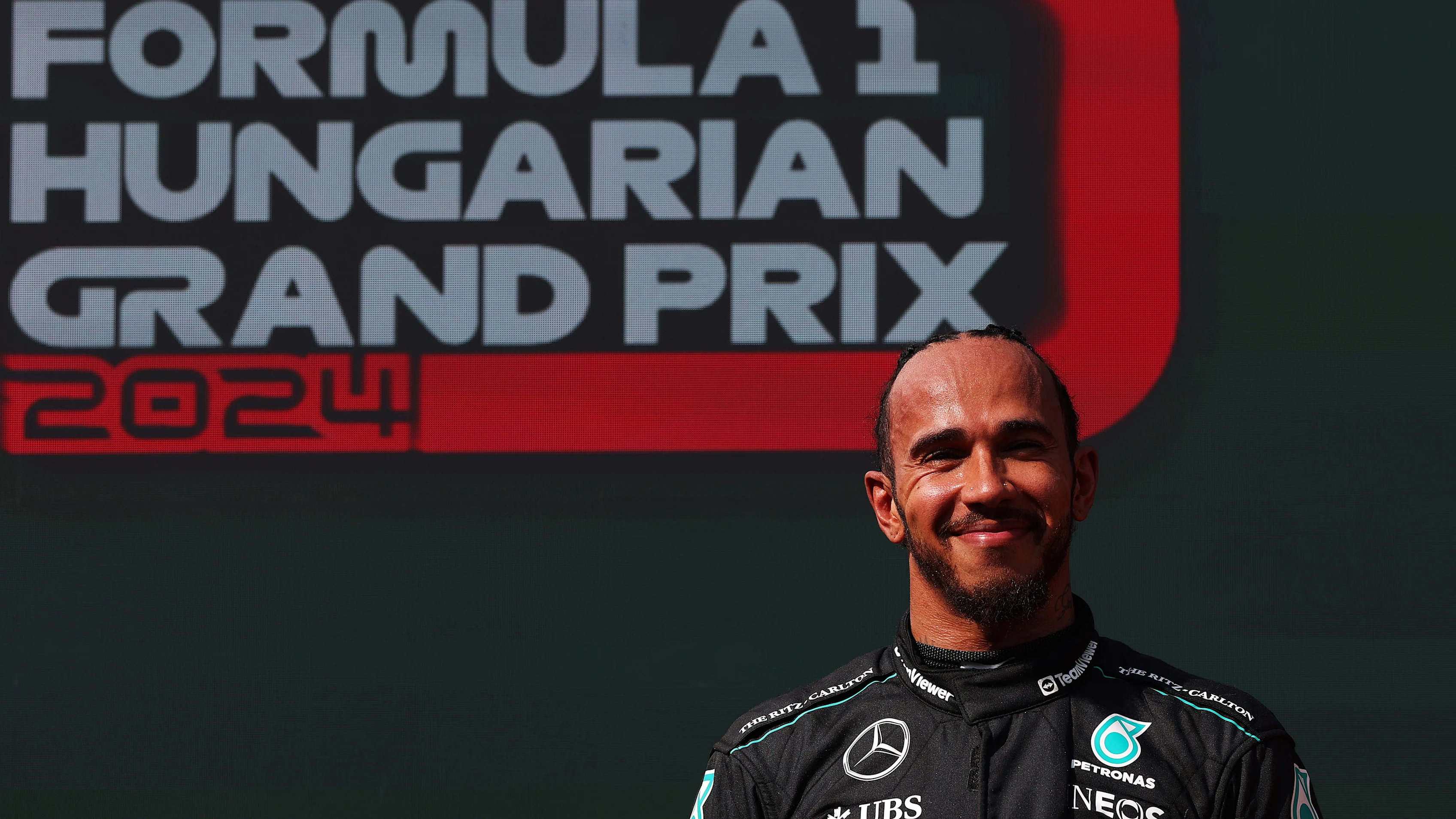 BUDAPEST, HUNGARY - JULY 21: Third placed Lewis Hamilton of Great Britain and Mercedes celebrates