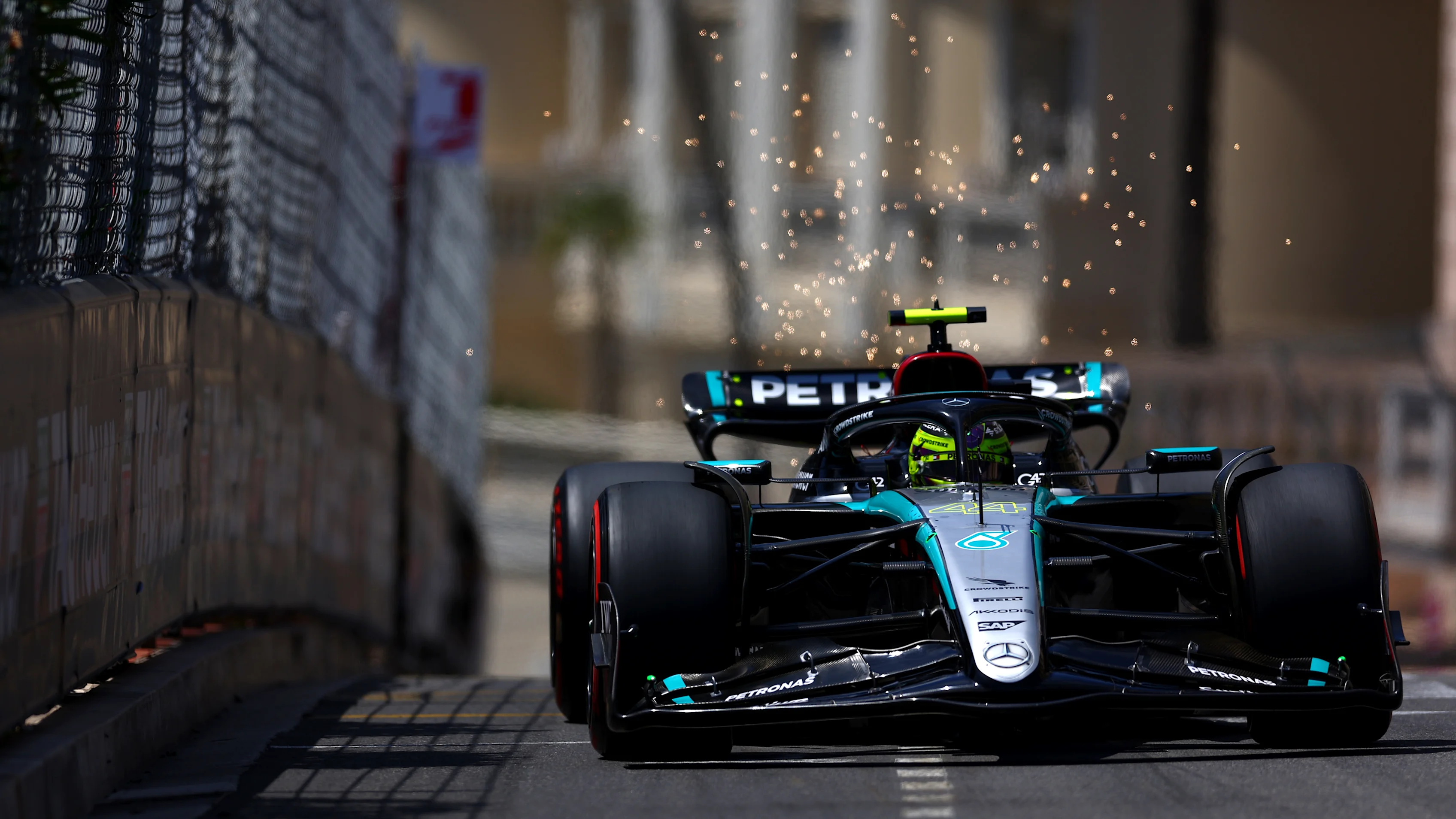 MONTE-CARLO, MONACO - MAY 25: Sparks fly behind Lewis Hamilton of Great Britain driving the (44)