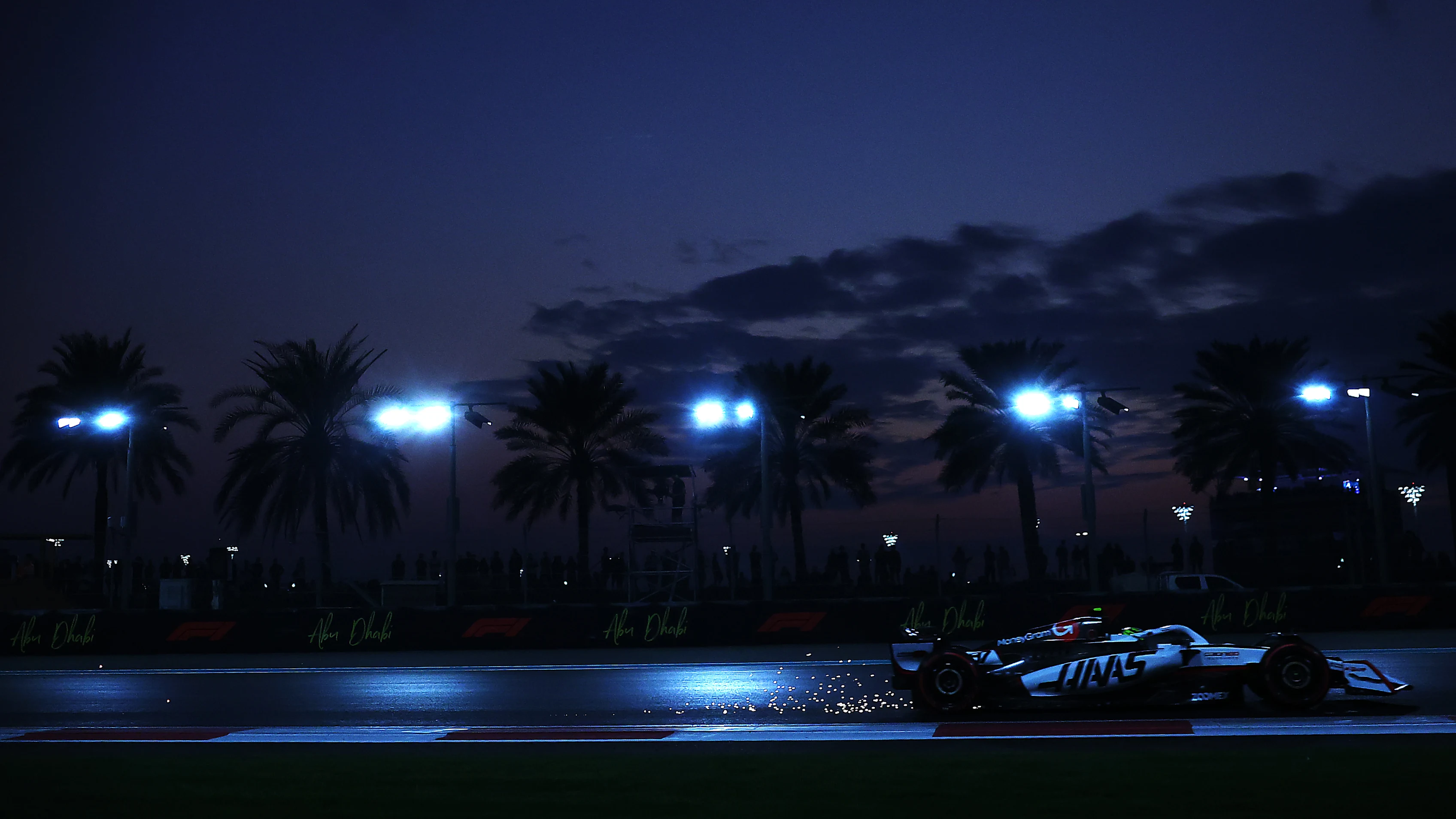 ABU DHABI, UNITED ARAB EMIRATES - DECEMBER 05: Sparks fly behind Oliver Bearman of Great Britain driving the (87) Haas F1 VF-25 Ferrari on track during practice ahead of the F1 Grand Prix of Abu Dhabi at Yas Marina Circuit on December 05, 2025 in Abu Dhabi, United Arab Emirates. (Photo by Mark Thompson/Getty Images)