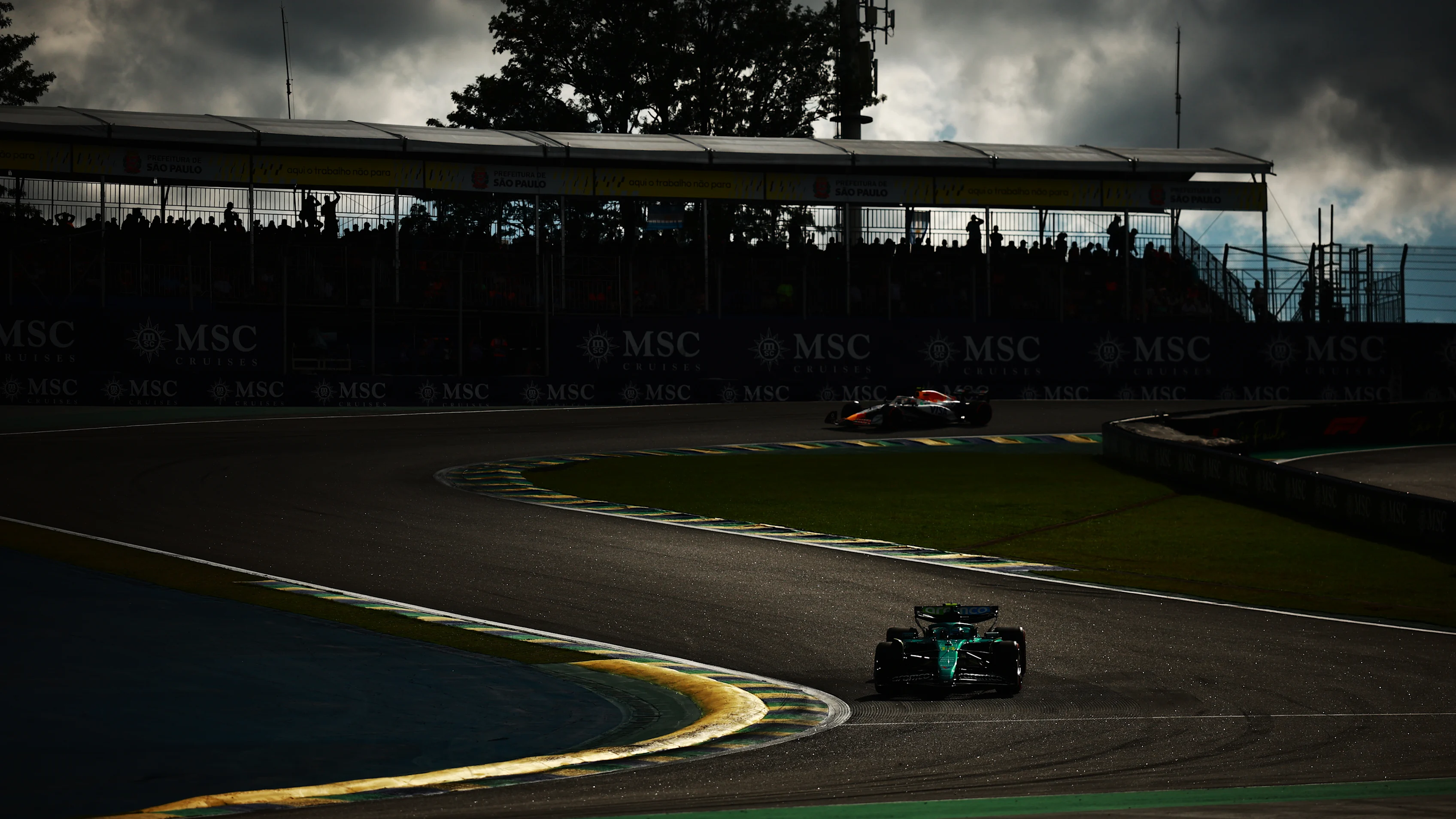 SAO PAULO, BRAZIL - NOVEMBER 08: Fernando Alonso of Spain driving the (14) Aston Martin F1 Team AMR25 Mercedes leads Liam Lawson of New Zealand driving the (30) Visa Cash App Racing Bulls VCARB 02 on track during qualifying ahead of the F1 Grand Prix of Brazil at Autodromo Jose Carlos Pace on November 08, 2025 in Sao Paulo, Brazil. (Photo by Hector Vivas/Getty Images)
