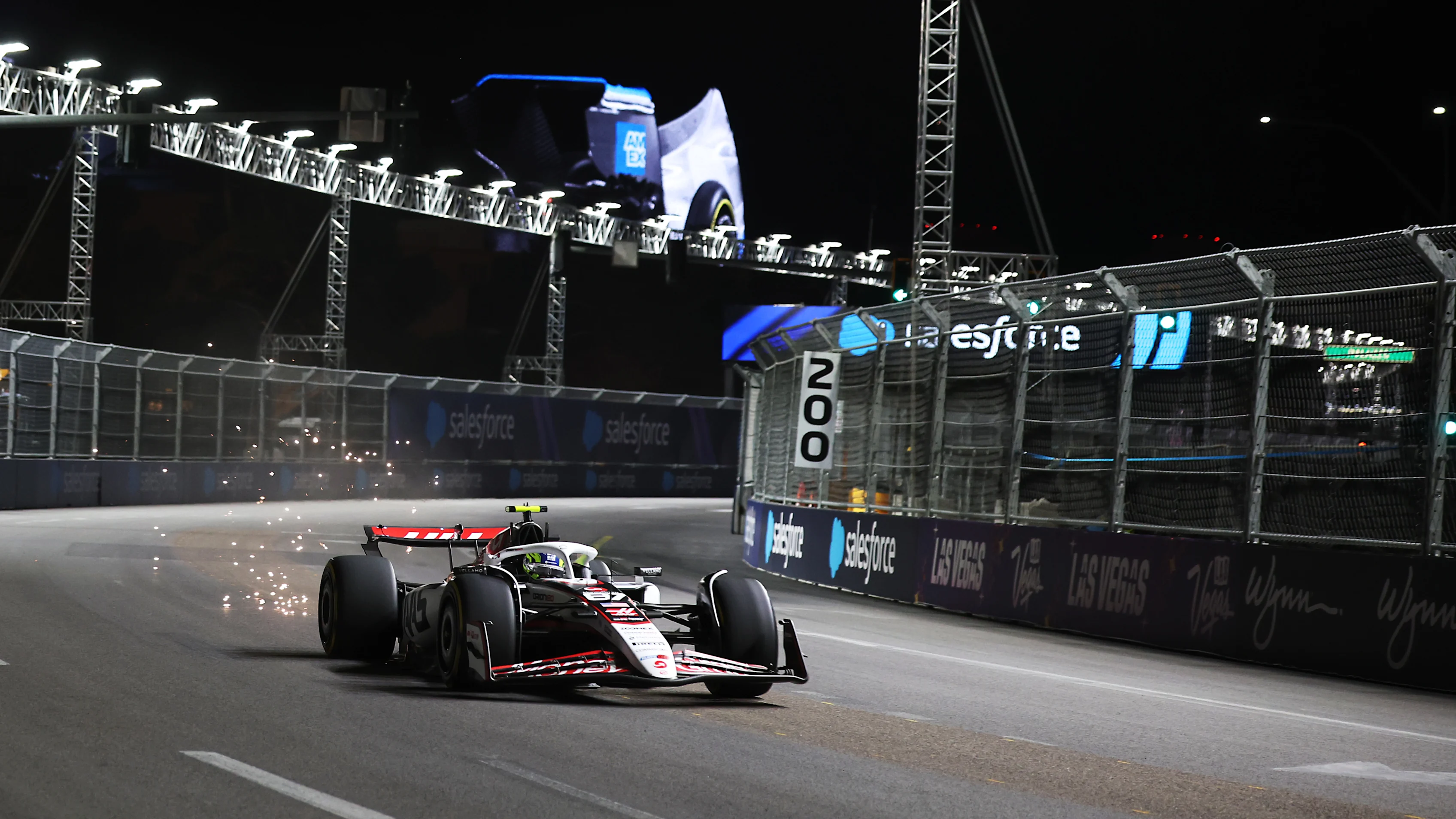 LAS VEGAS, NEVADA - NOVEMBER 20: Sparks fly behind Oliver Bearman of Great Britain driving the (87) Haas F1 VF-25 Ferrari on track during practice ahead of the F1 Grand Prix of Las Vegas at Las Vegas Strip Circuit on November 20, 2025 in Las Vegas, Nevada. (Photo by Chris Graythen/Getty Images)