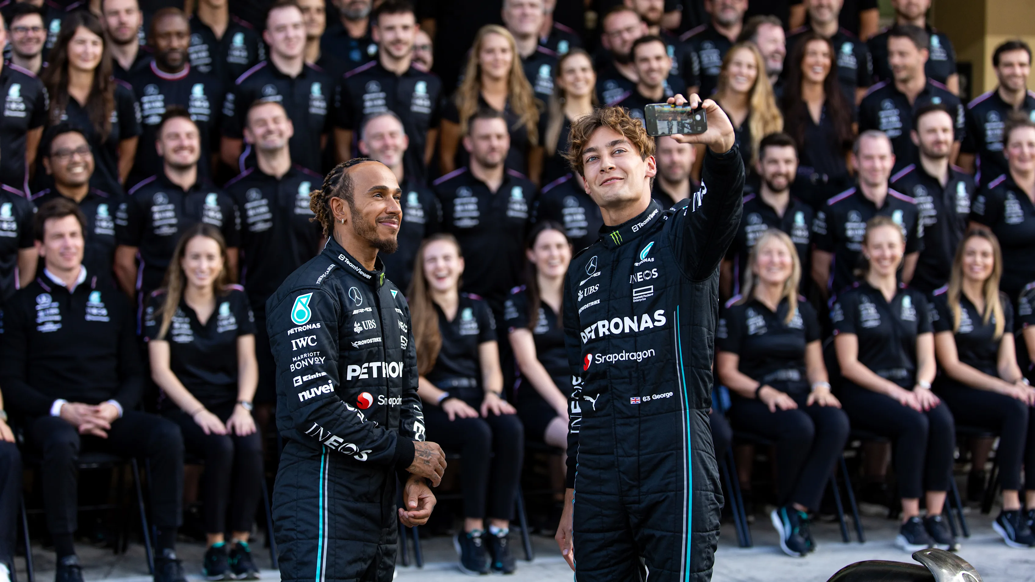 ABU DHABI, UNITED ARAB EMIRATES - NOVEMBER 23: George Russell and Lewis Hamilton of Great Britain