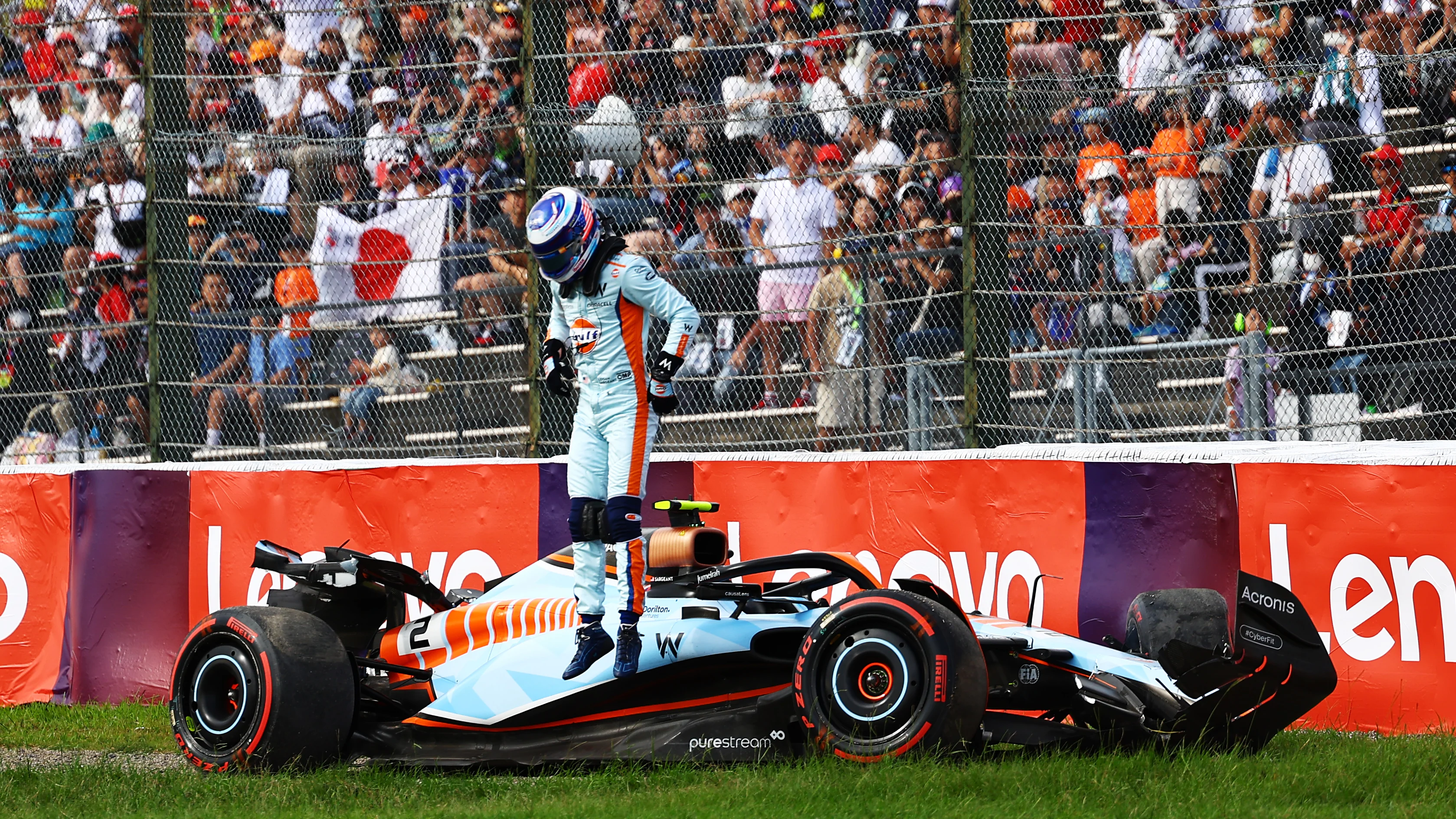 SUZUKA, JAPAN - SEPTEMBER 23: Logan Sargeant of United States and Williams climbs from his car