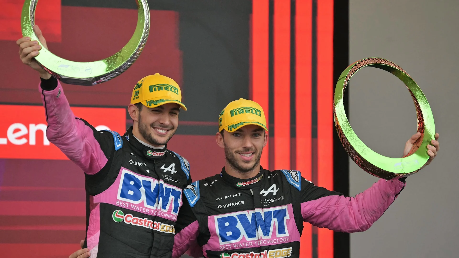 Alpine's French drivers Esteban Ocon (L) and Pierre Gasly celebrate at the podium their second and