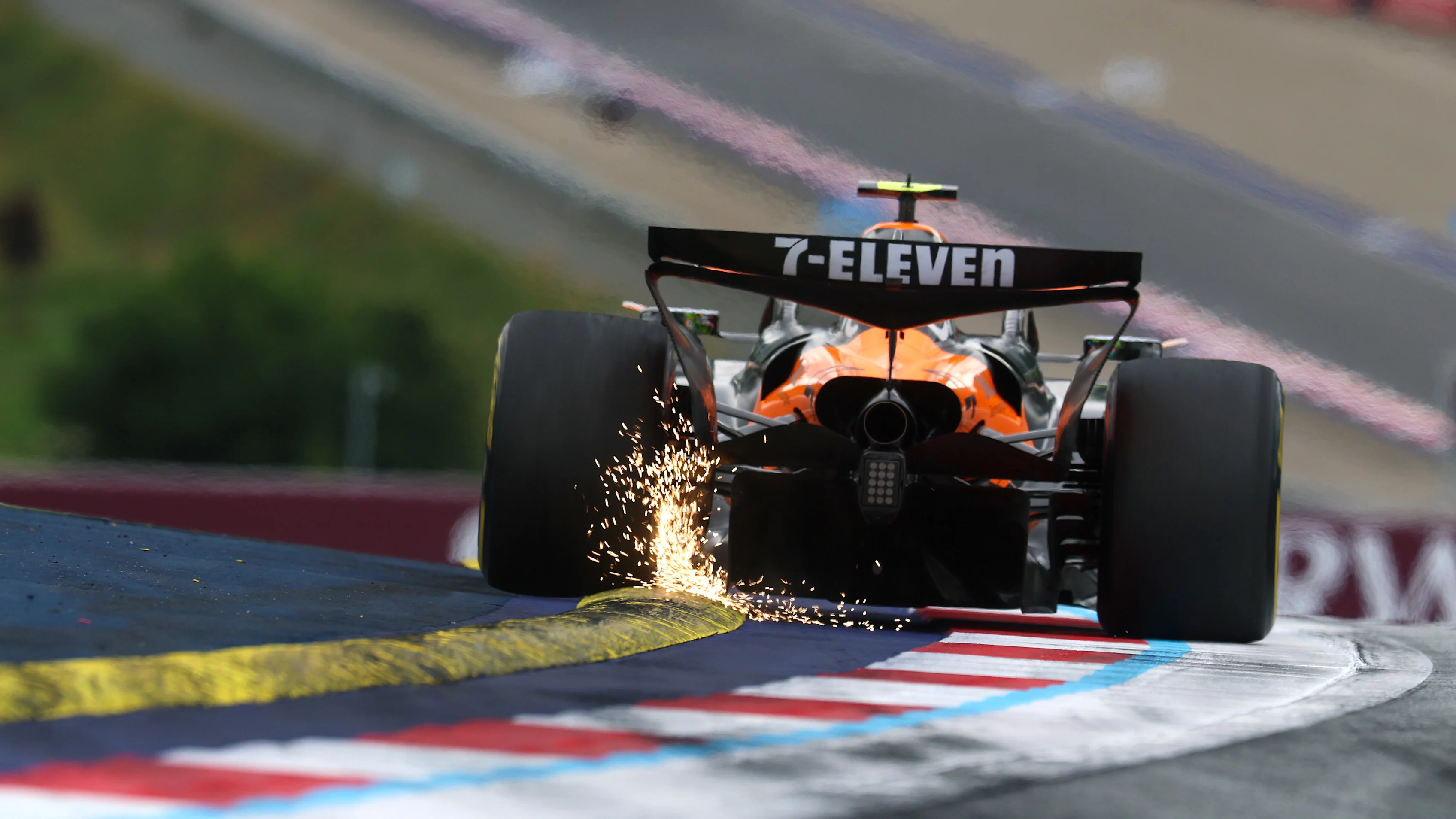 SPIELBERG, AUSTRIA - JUNE 27: Sparks fly behind Lando Norris of Great Britain driving the (4)