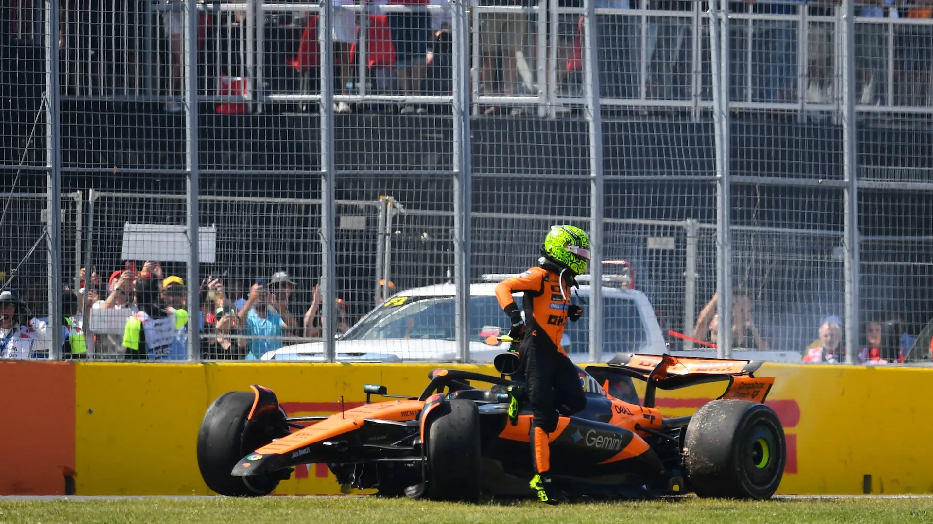 MONTREAL, QUEBEC - JUNE 15: Lando Norris of Great Britain and McLaren walks away from his damaged