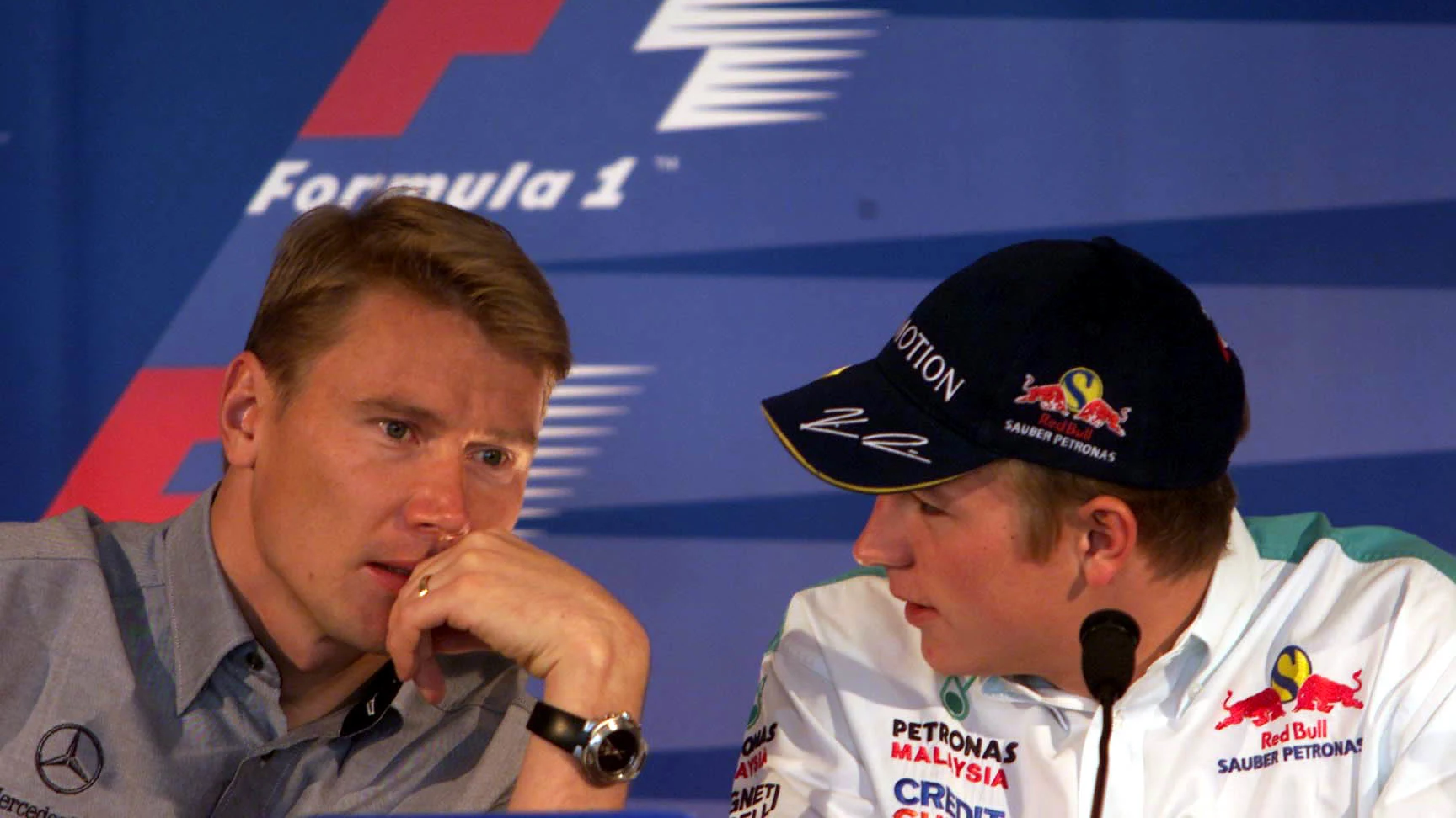 27 Sep 2001:  Mika Hakinnen of Finland talks to the driver who will take his seat at McLaren next